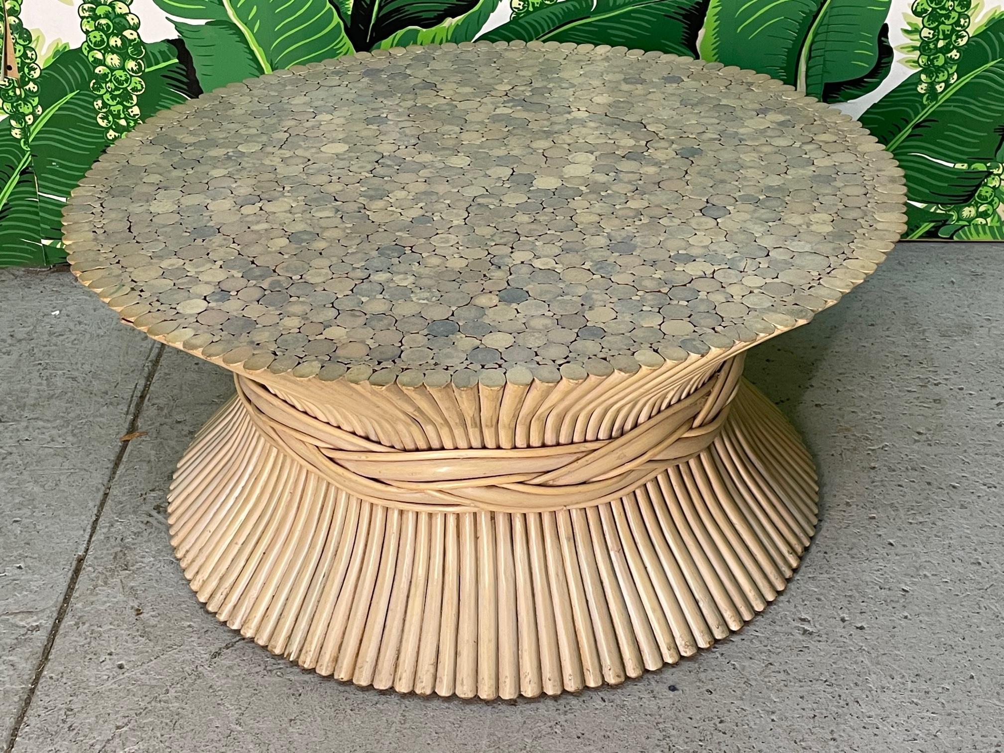 Rattan coffee or cocktail table in the iconic sheaf of wheat motif in the manner of McGuire. Good condition with minor imperfections consistent with age.