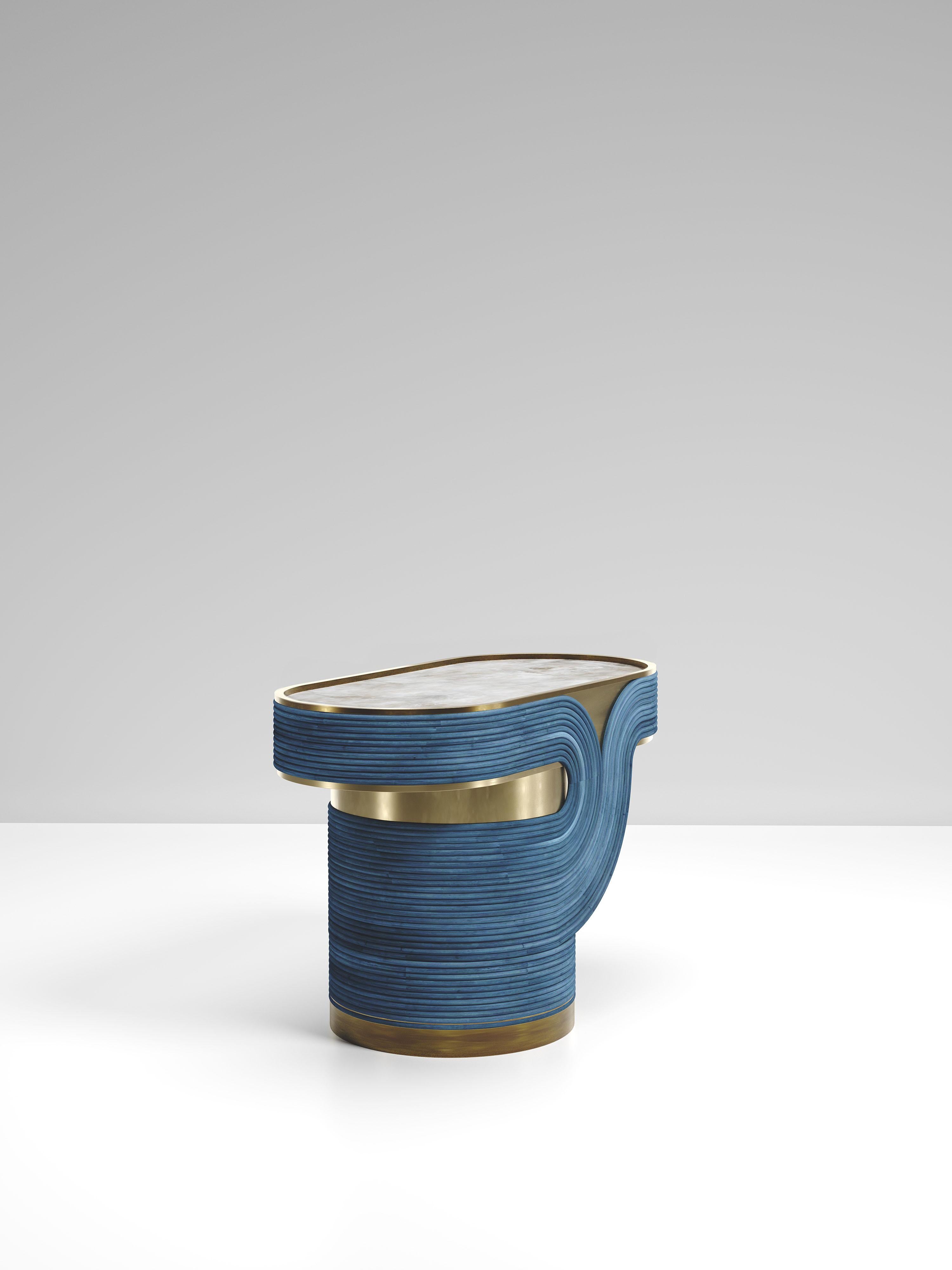 The Licol Side table by R & Y Augousti is a part of their new Rattan capsule launch. The piece explores the brand's iconic DNA of bringing old world artisanal craft into a contemporary and utterly luxury feel. This table is done in a blue rattan