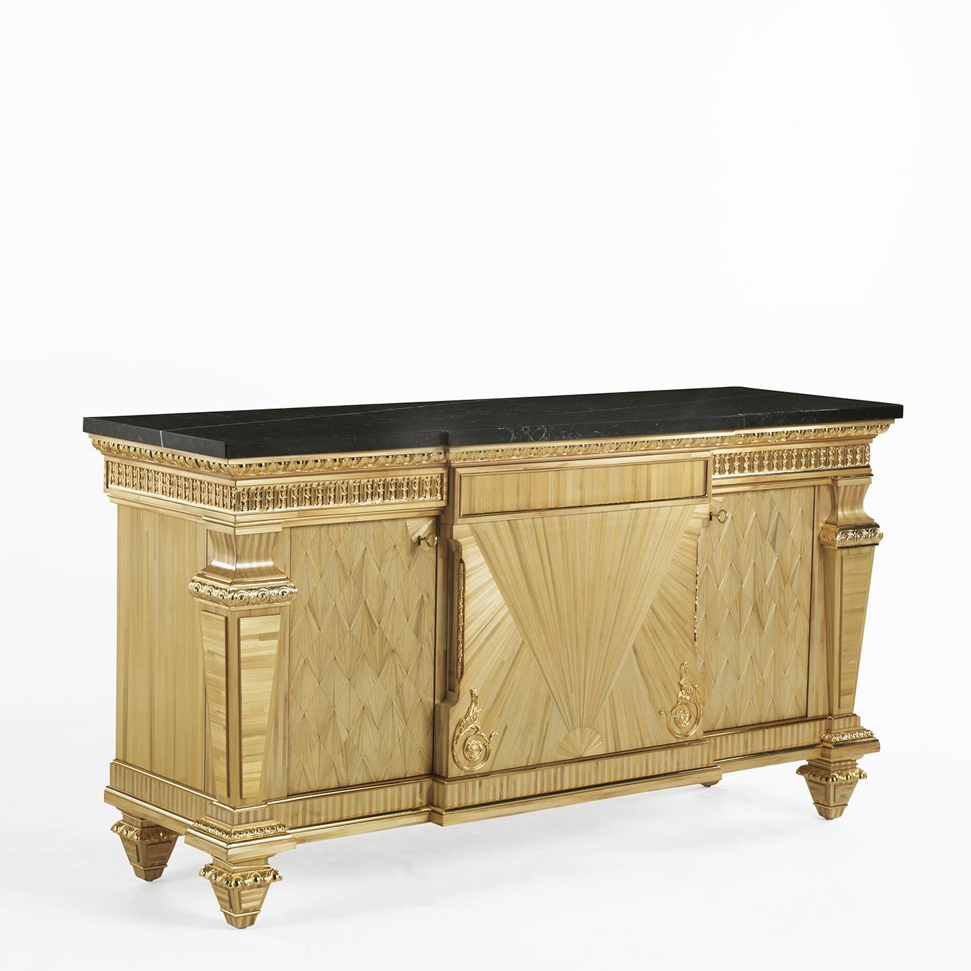 A magnificent piece of functional decor inspired by 19th century neoclassical style, this sideboard will be a precious and sophisticated addition to a classic home. The structure in wood is veneered throughout with rattan with a natural finish. The