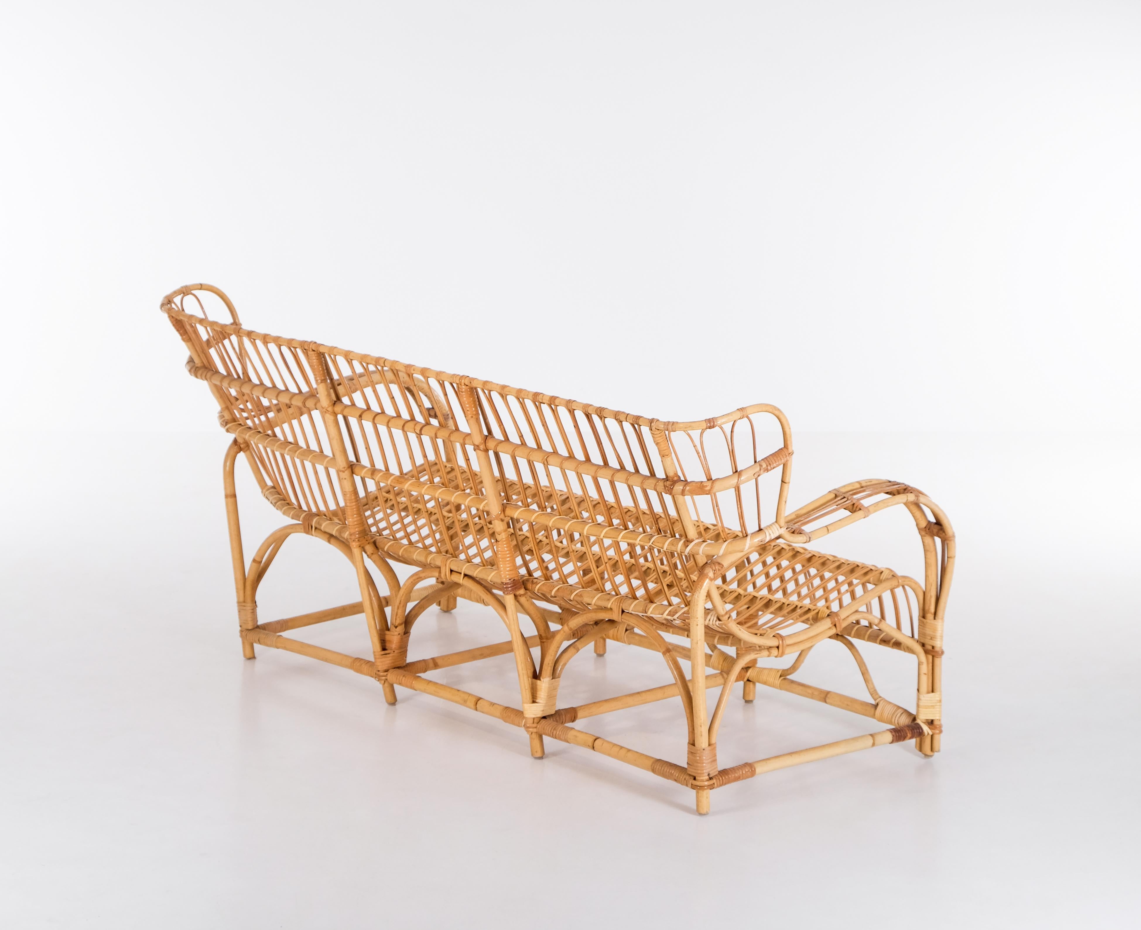 Rattan and cane. Good vintage condition, with minor signs of usage and patina.