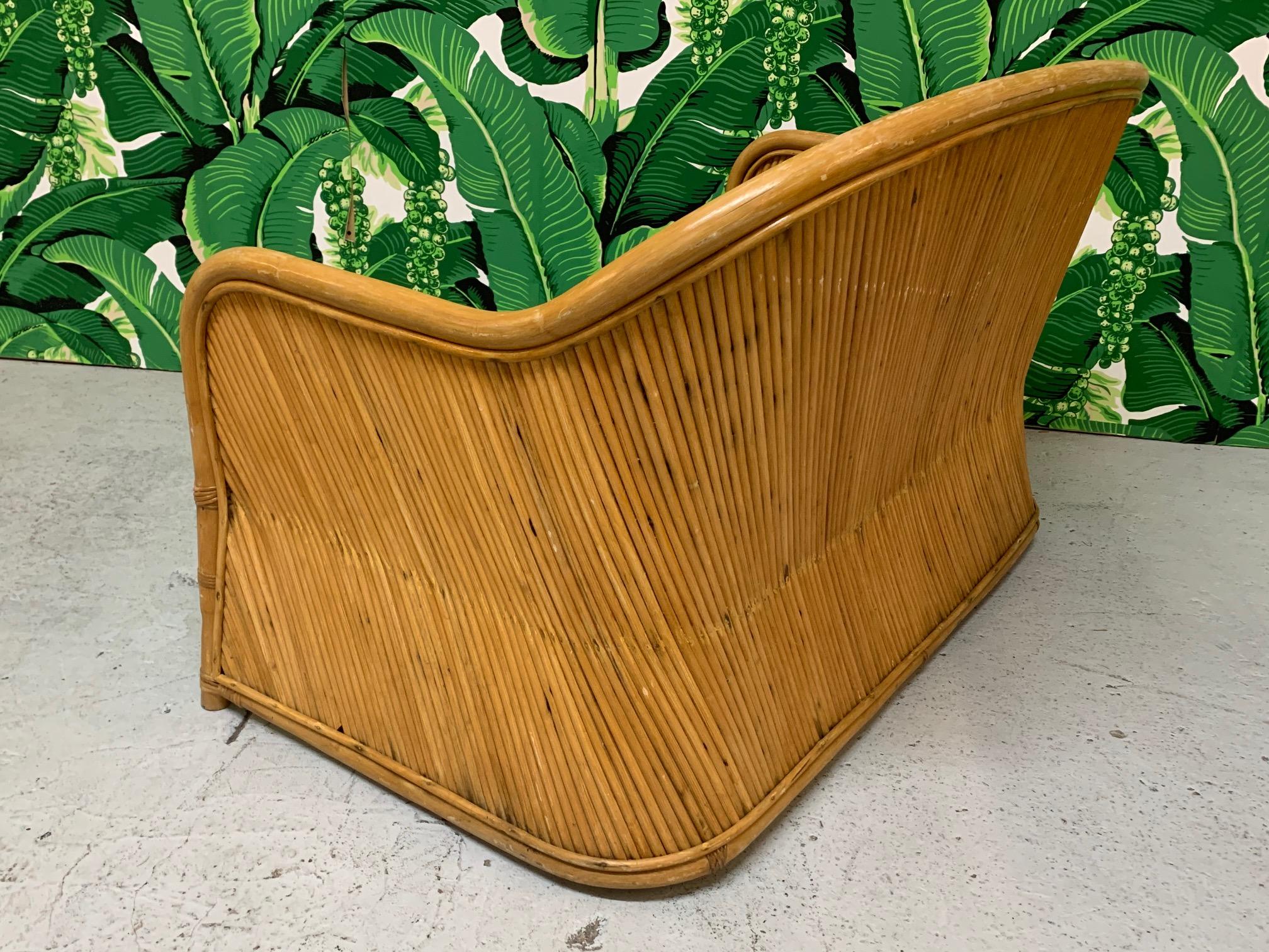 Fabulous split reed rattan wrapped loveseat. Interesting shape with diagonal reed design. Good condition with only minor imperfections consistent with age.