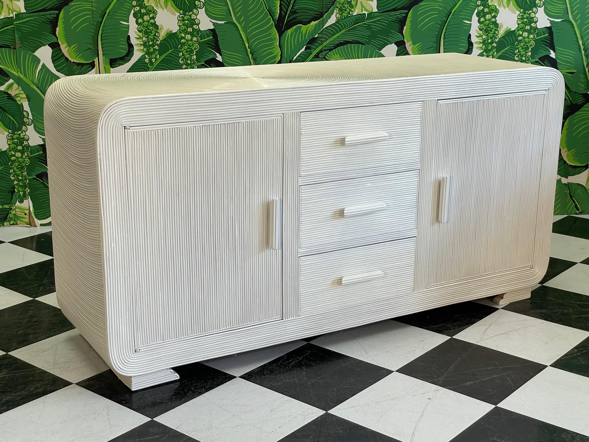 Vintage rattan dresser features a full veneer of pencil reed in the iconic 