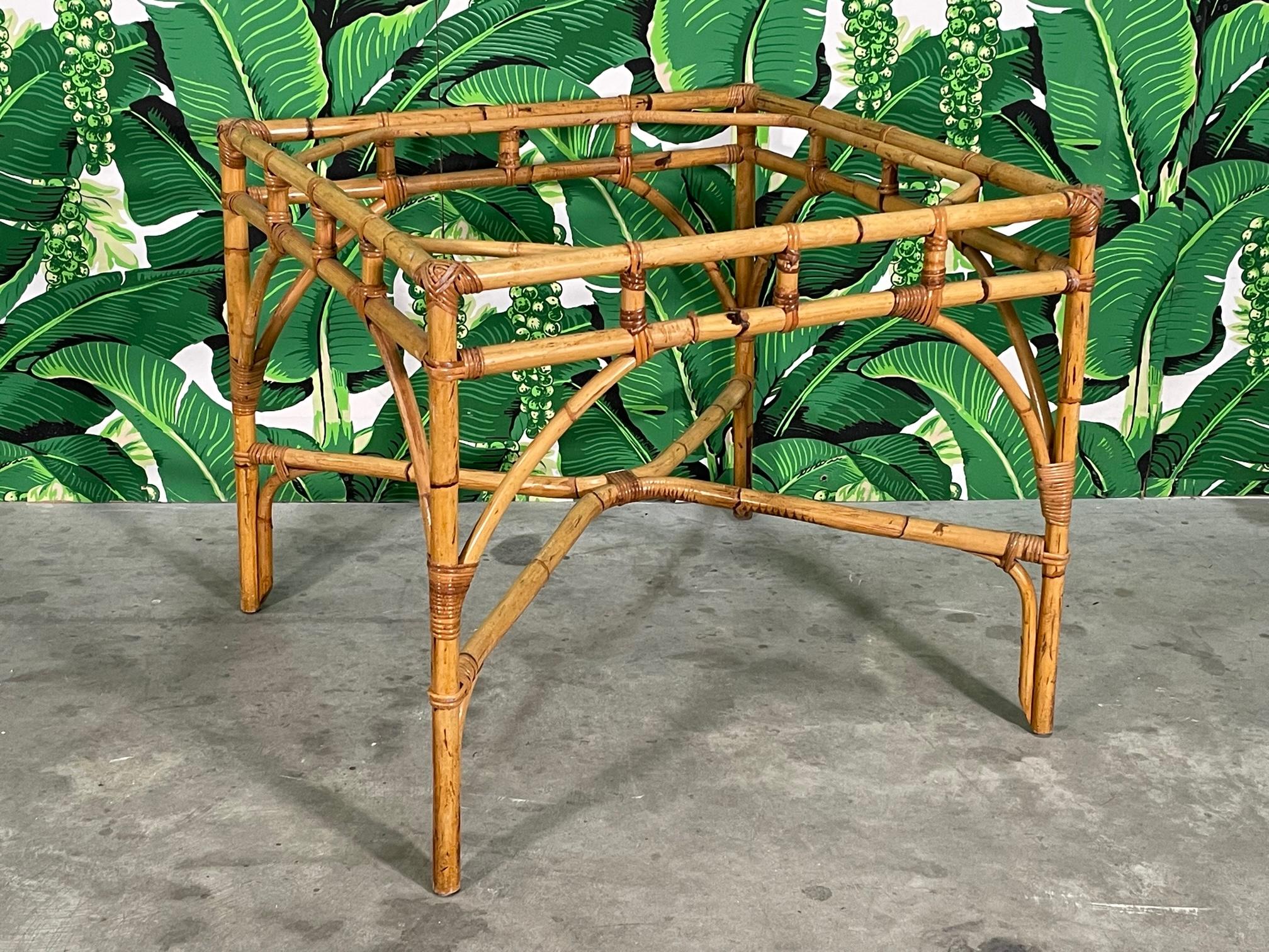 Mid-century rattan square dining table ready for your glass or solid top. Arch spandrels and wicker wrapped joints. Good condition with imperfections consistent with age (see photos).

 