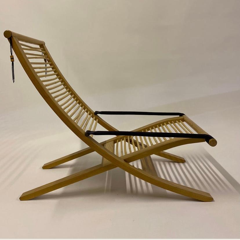 A uniquely designed lounge chair & ottoman by the well known Welsh designer David Colwell. The chair & ottoman are no longer in production & this chair now sits in the Victoria & Albert Museum in London. The chair has three seating positions & folds