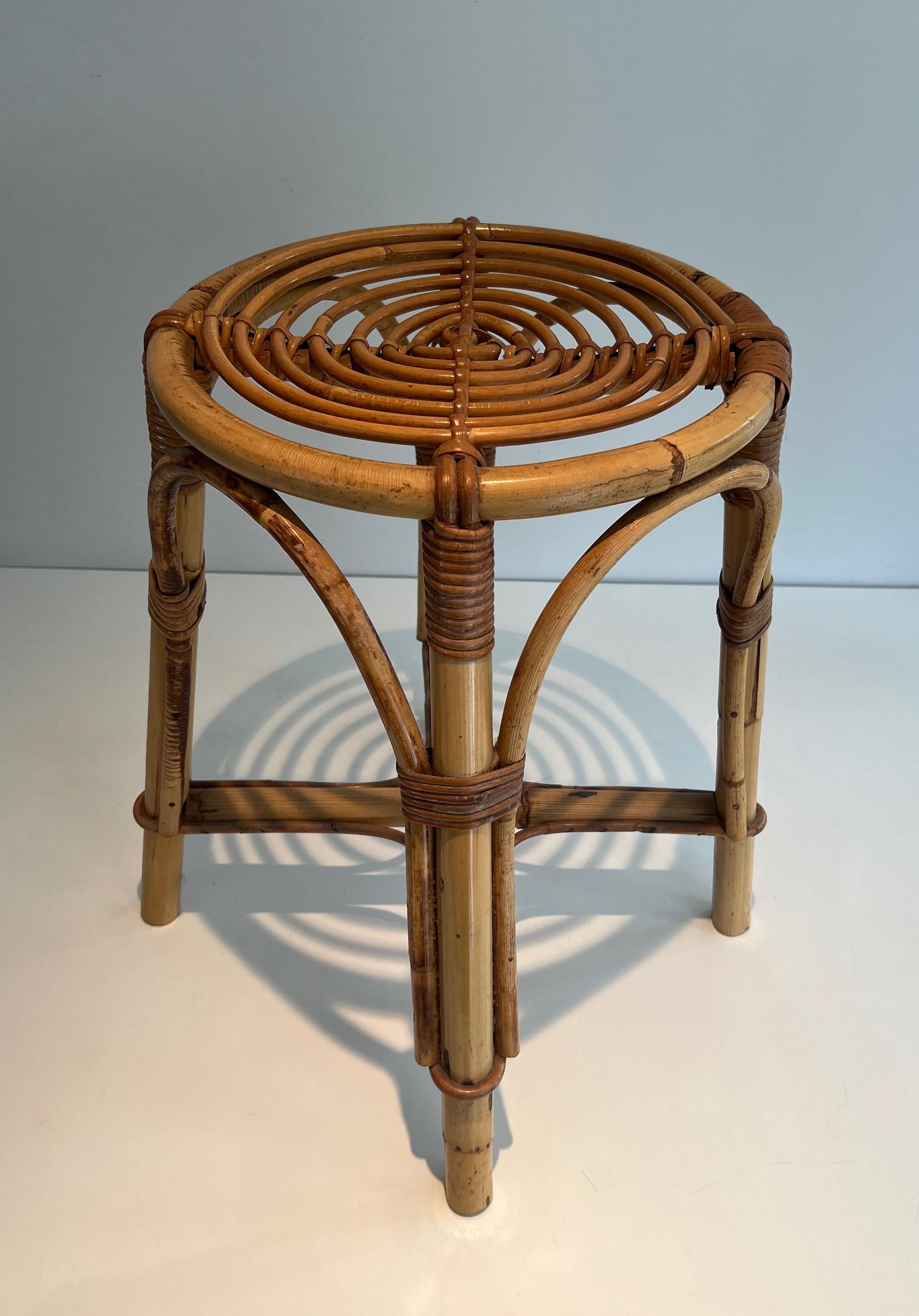 This very nice and unusual stool is made of rattan. This is a French work. Circa 1970