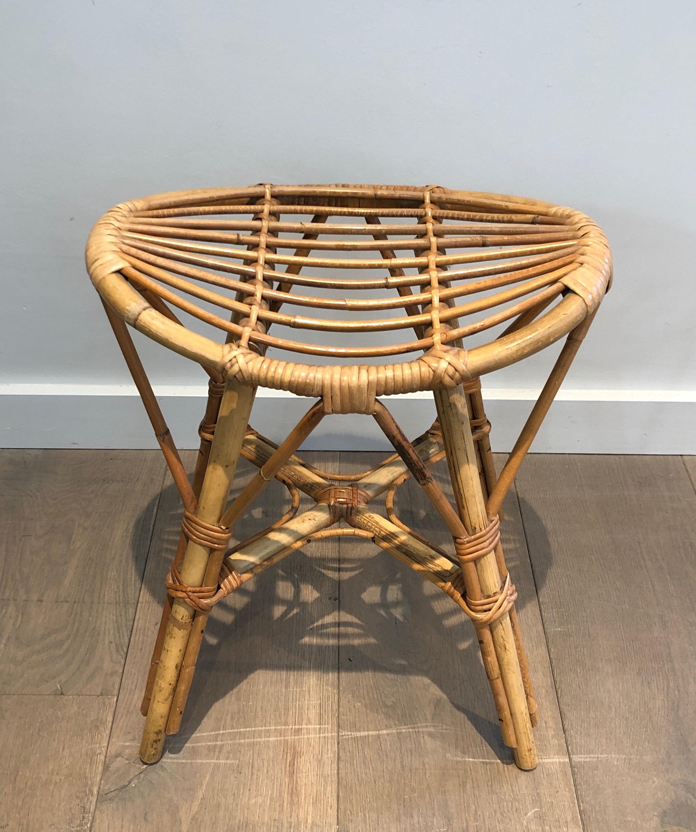 This nice stool is made of rattan. This is a French work. Circa 1970.