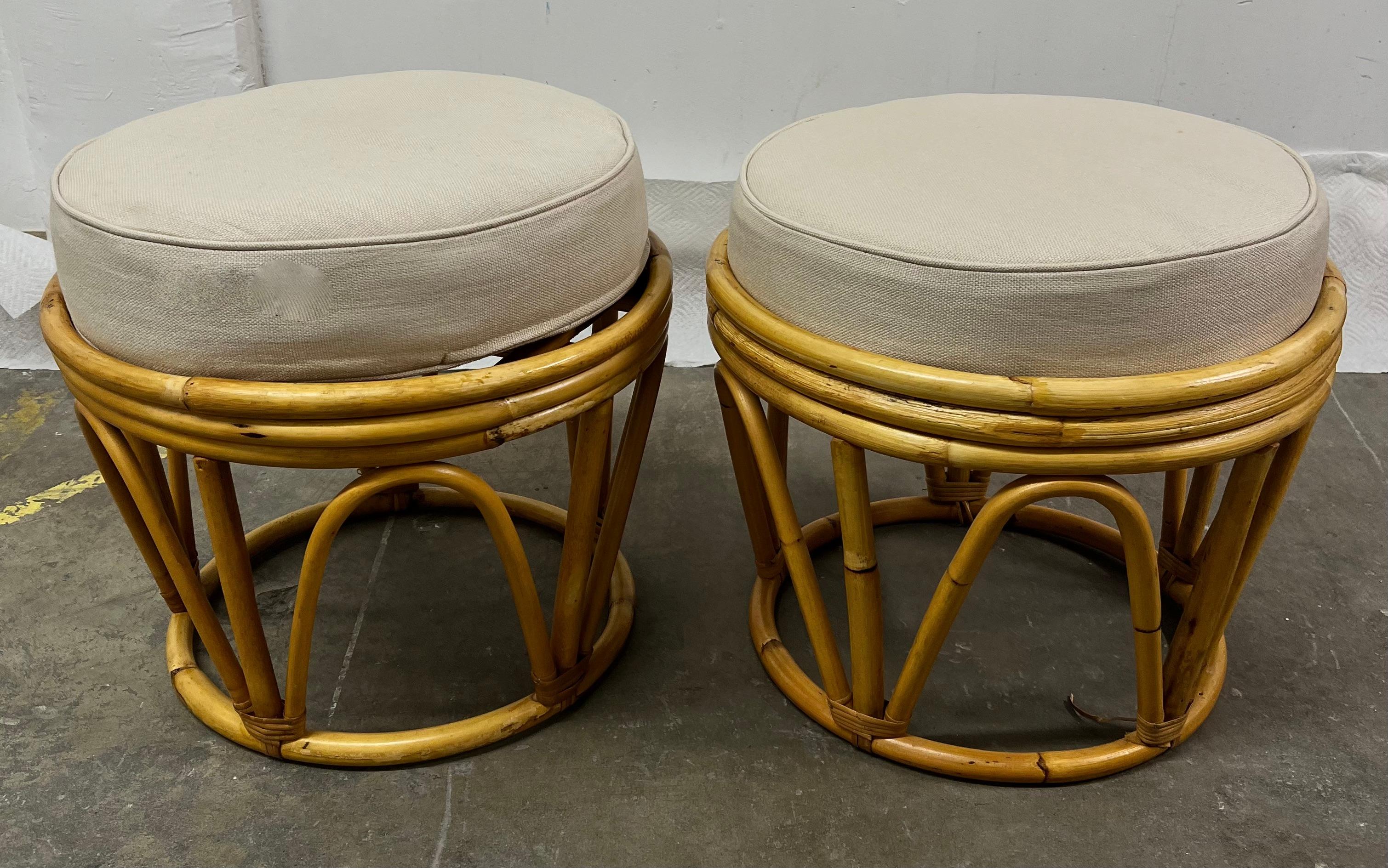 A lovely pair of Rattan stools or ottomans. The pair, with a piece of glass, stone or wood, could also be utilized as side tables.

A very hot look right now - rattan is a perfect compliment to any relaxed, ethnic or garden setting, from the
