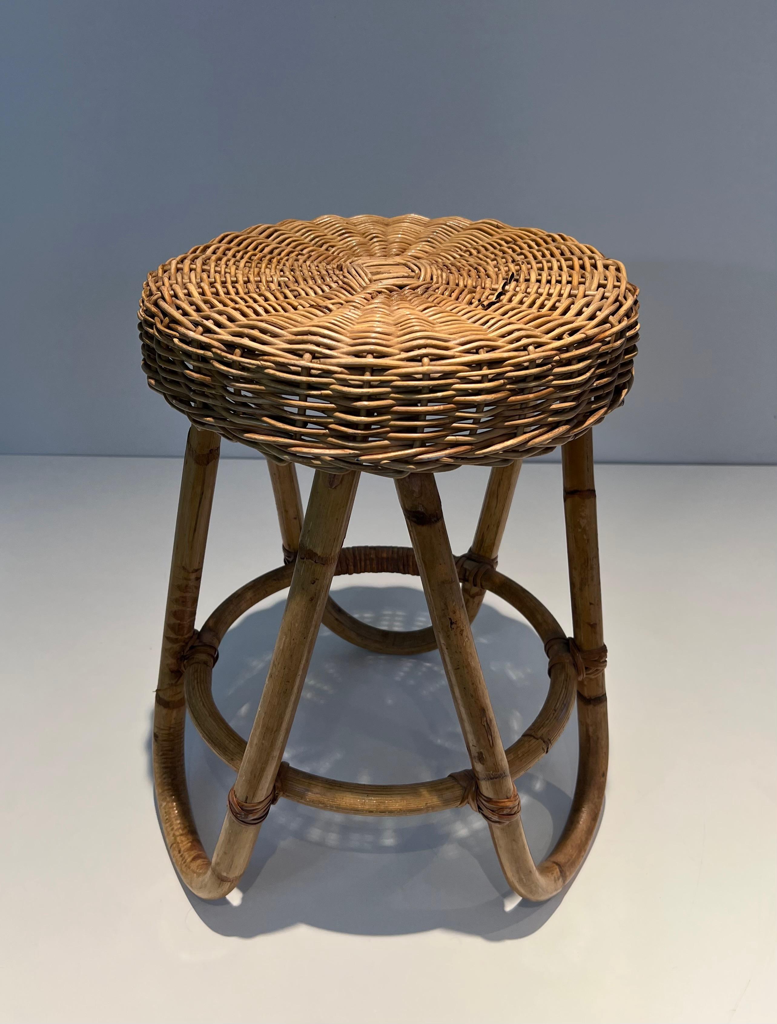 This very nice and unusual stool is made of rattan. This is a French work. Circa 1950