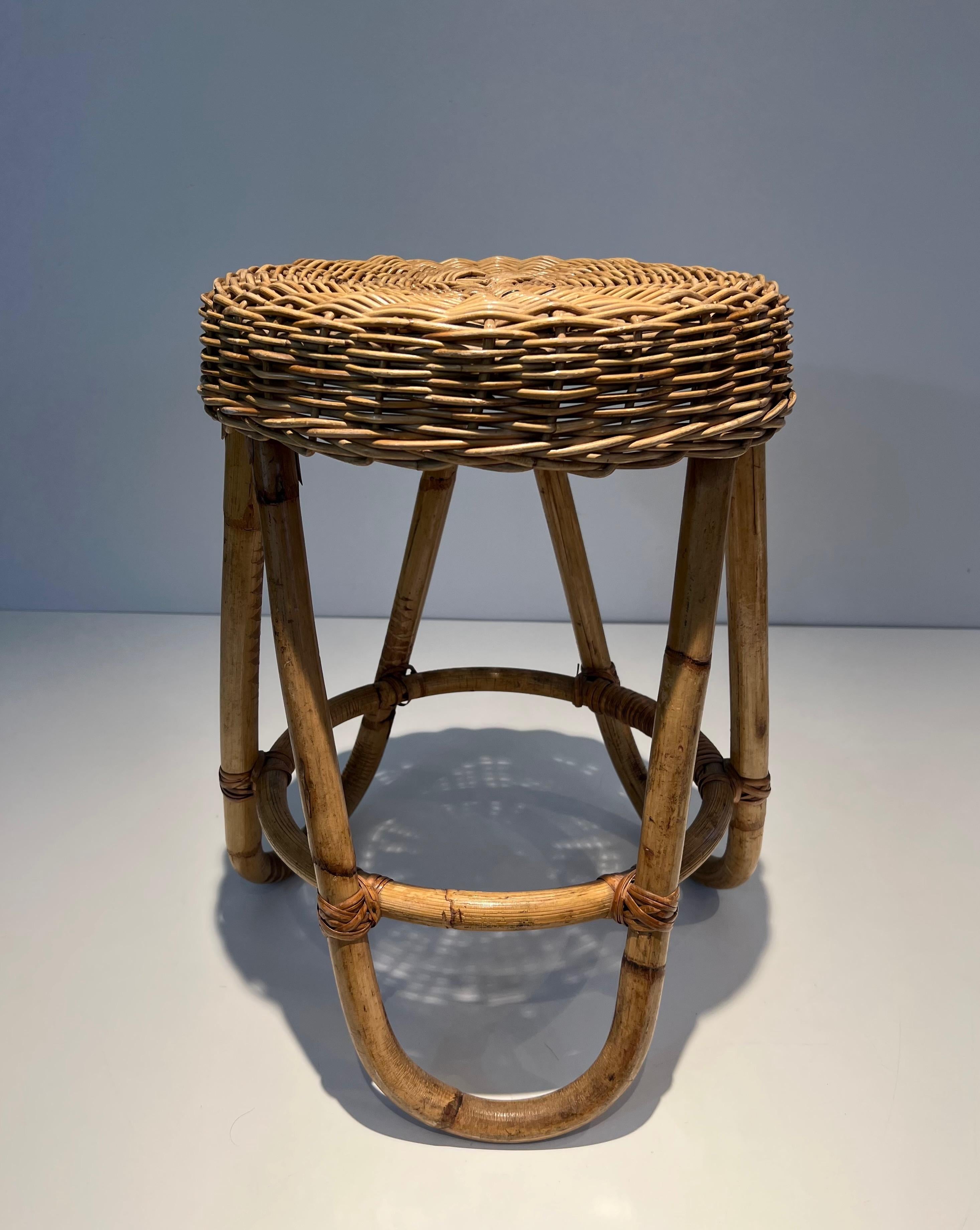 Mid-Century Modern Rattan Stool. This is a French work. Circa 1950 For Sale