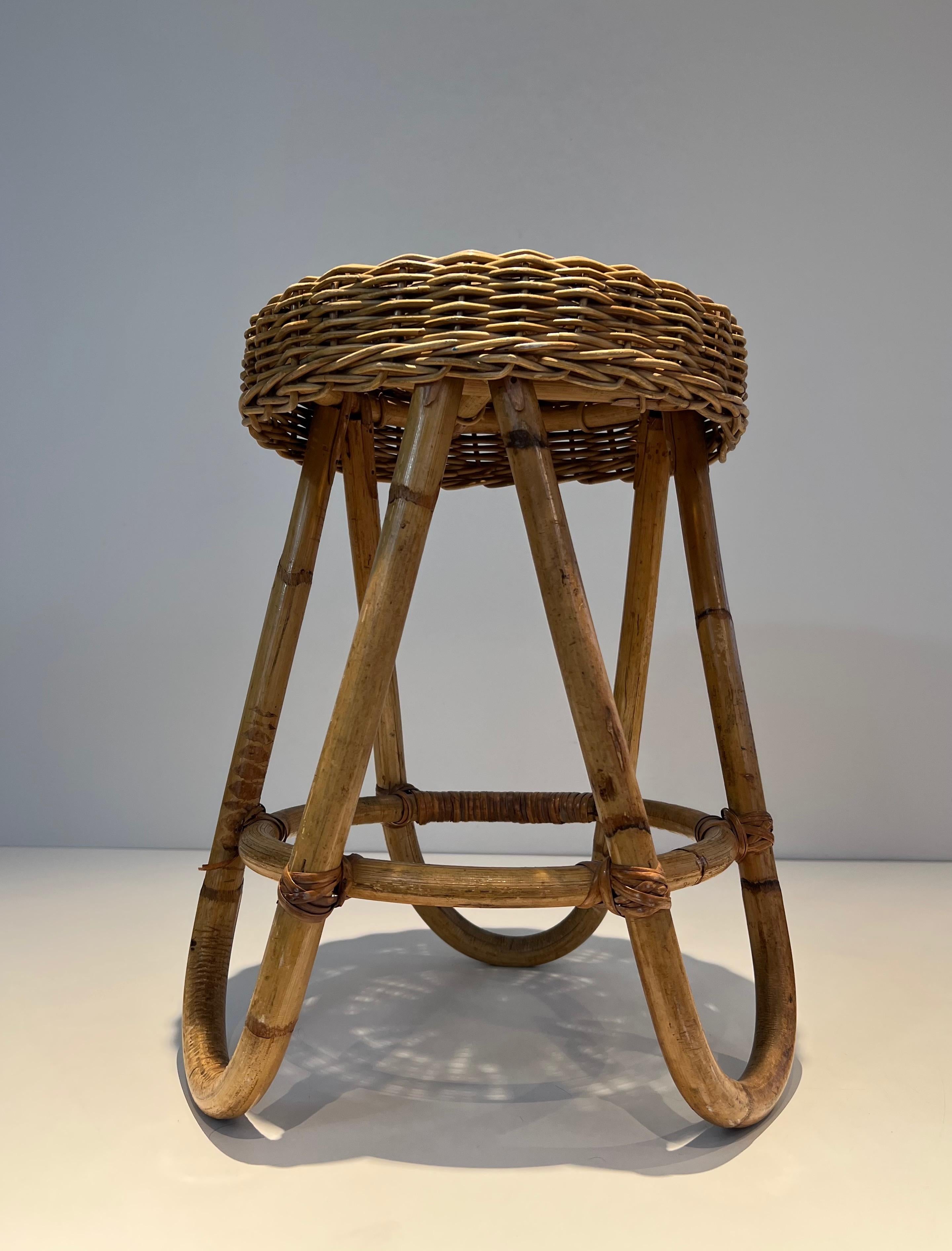 Mid-20th Century Rattan Stool. This is a French work. Circa 1950 For Sale