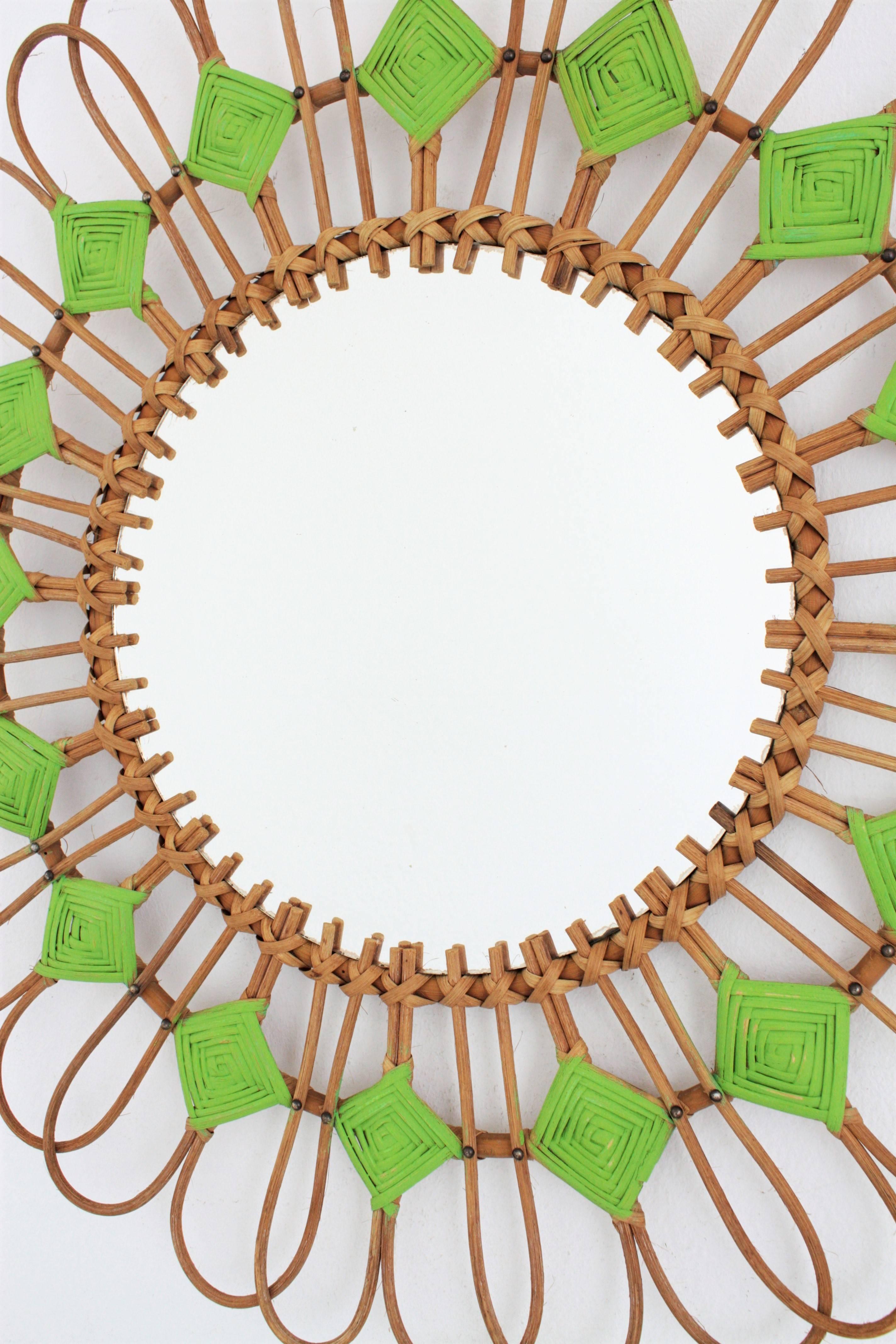 Spanish rattan sunburst flower mirror with green rhombus details, 1950s
Unusual handcrafted rattan mirror with green painted rhombus decorations with all the taste of the Mediterranean coast style.
This mirror can add a fresh taste to a