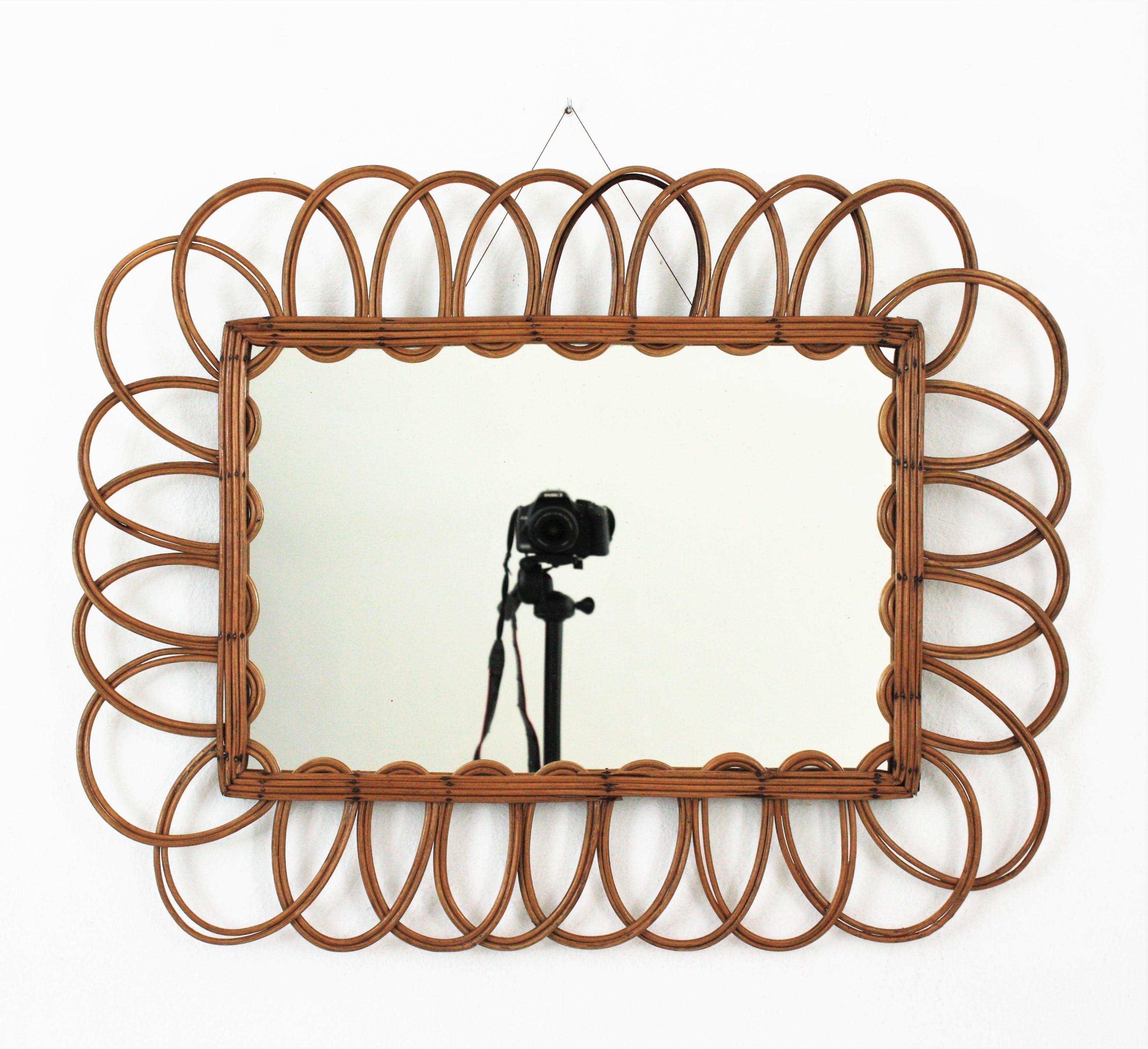 Beautiful midcentury French flower shaped sunburst mirror made in rattan. France, 1960s
This cool rattan mirror has all the taste of the French Riviera and will add a fresh accent to a beach house or countryside house decoration.
Lovely placed