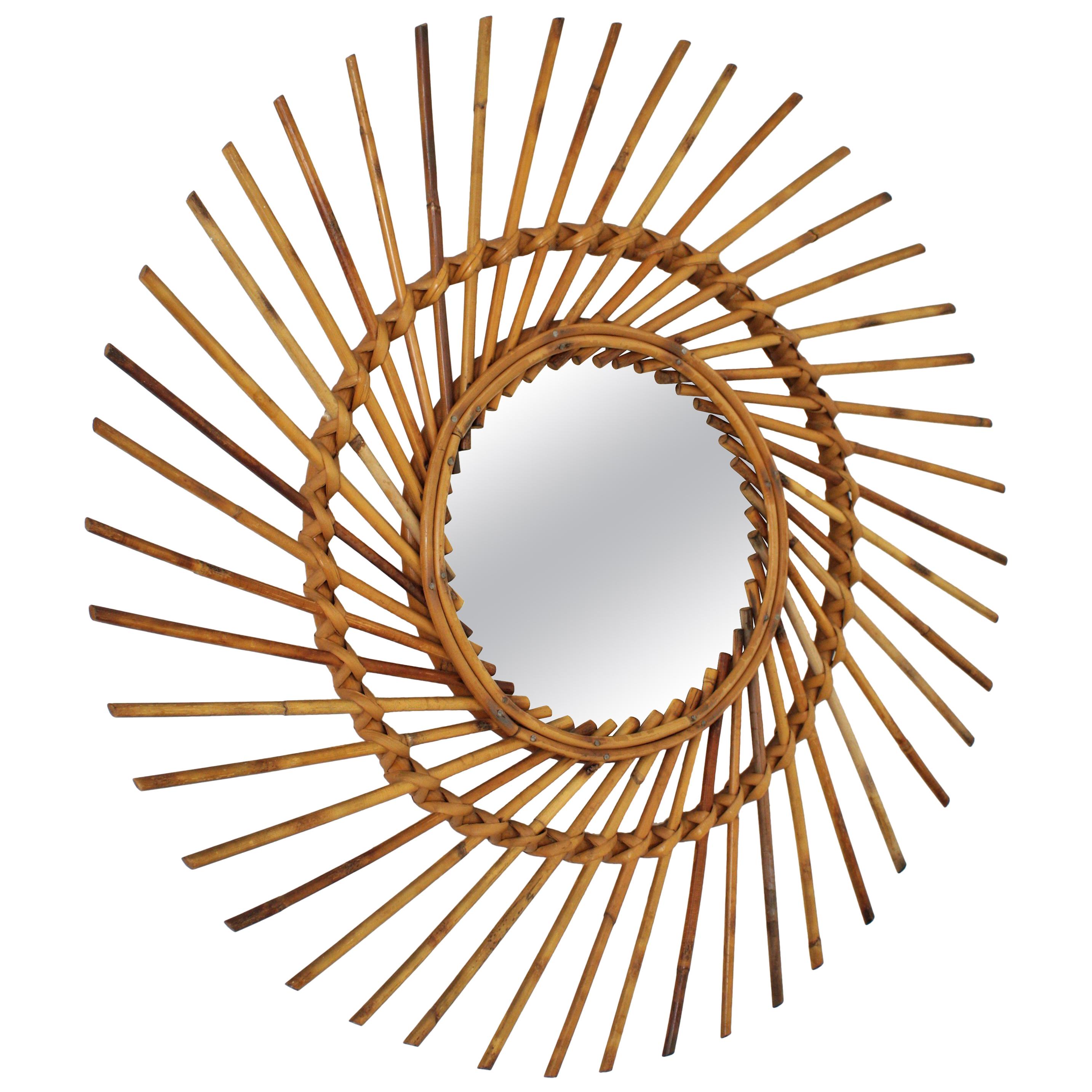 Midcentury sunburst mirror handcrafted in rattan. Spain, 1960s.
This handcrafted sunburst mirror has a design with pinwheel shape. It has all the taste of the Mediterrean coast style and it will be a nice addition to any beach house or countryside
