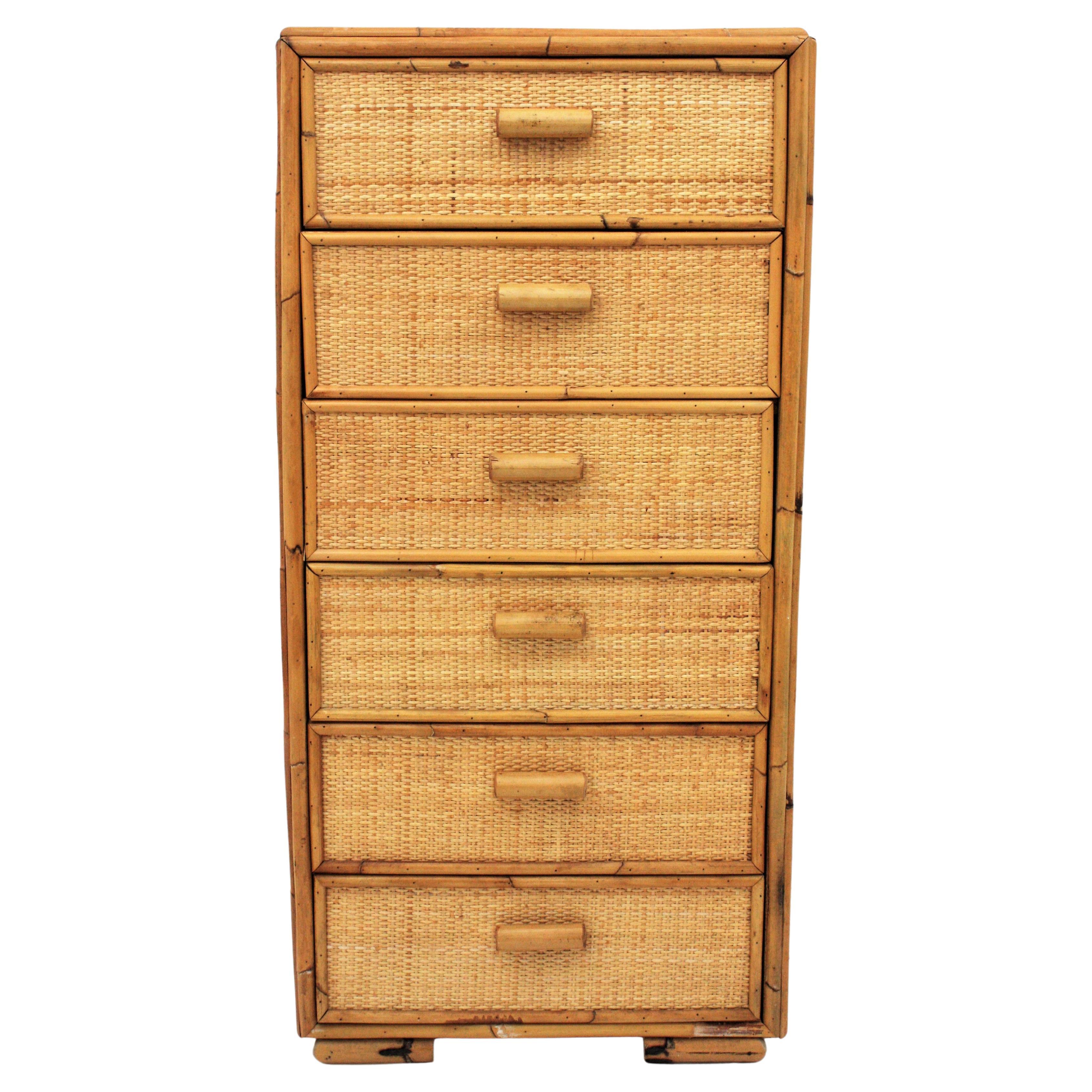 Rattan woven wicker six-drawer tall boy dresser or slim chest of drawers. Spain, 1960s

This beautiful rattan dresser has a bamboo and rattan structure with six drawers all covered by rattan weave accented by rattan pulls.
It will be a nice