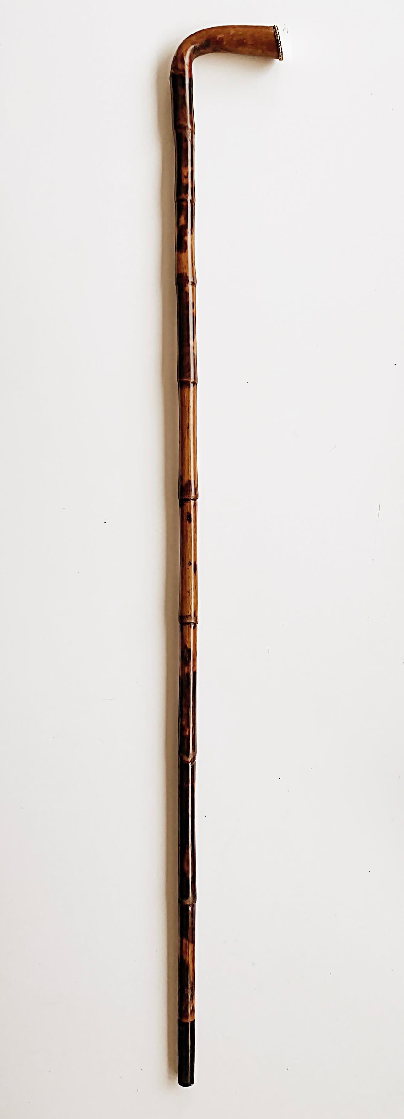 Rattan Walking Stick Gold cap Monogrammed Christmas 1895, Bamboo

Offered for sale is a late 19th century antique rattan/bamboo walking stick that has a gold beaded end cap on the handle. The gold cap is elegantly engraved
