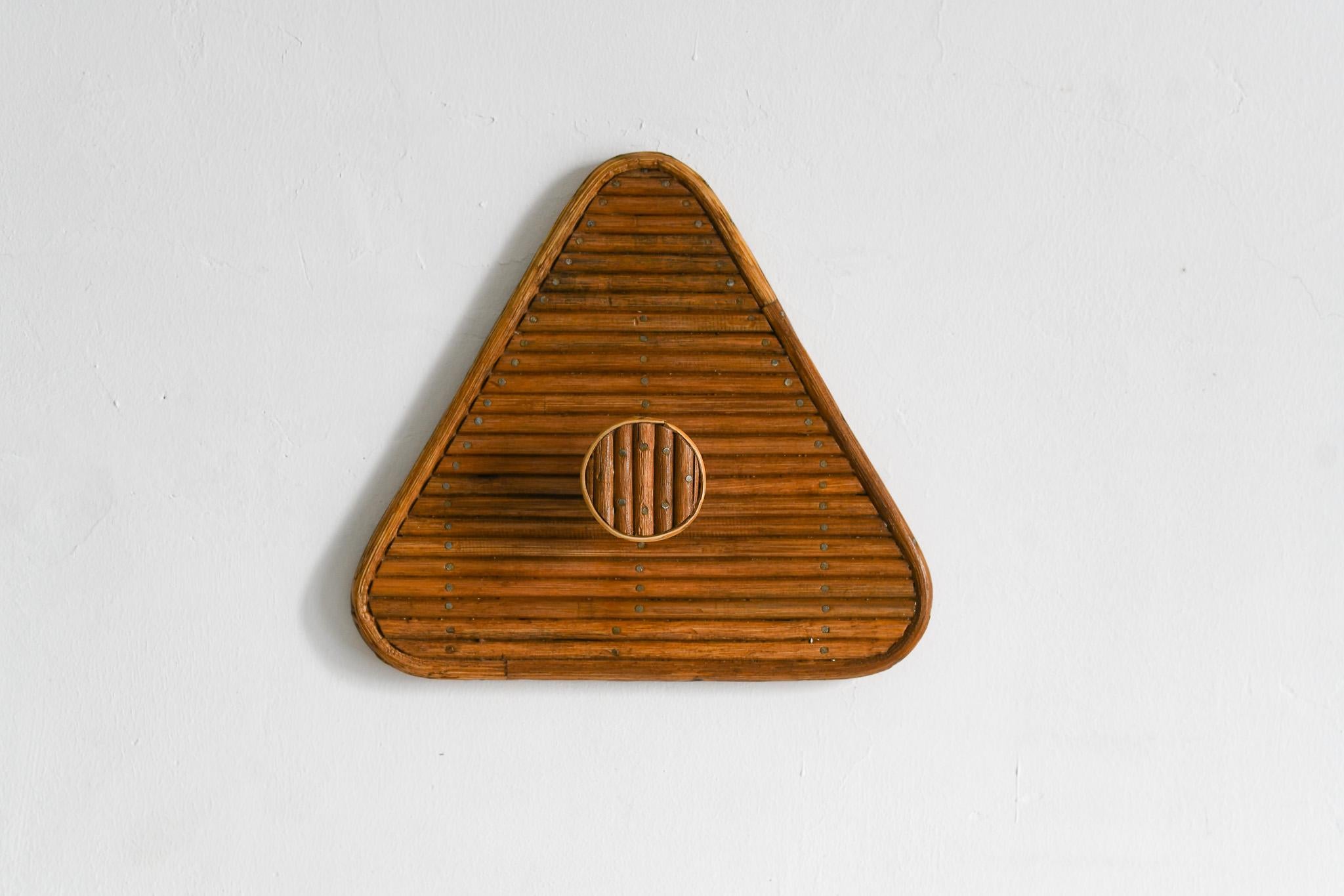 This elegant Triangle Shaped Rattan Wall Hook is the perfect addition to any room. Its mid-century Italian design in a rattan core with a triangle shape is ideal for entryways, bathrooms, and bedrooms. Installation is simple, and its modern and