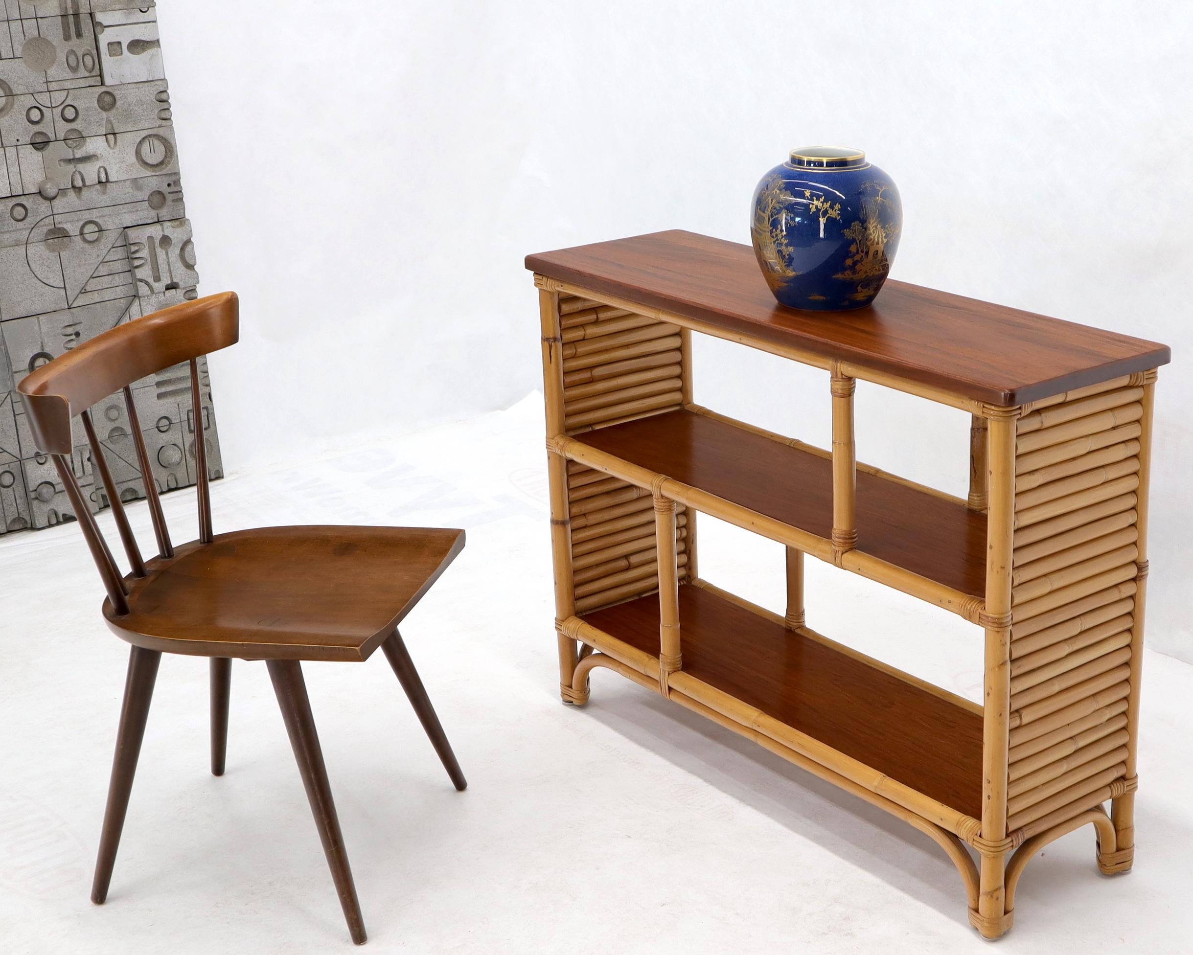 Very nice decorative Mid-Century Modern rattan and bamboo console table with bookcase like shelves.