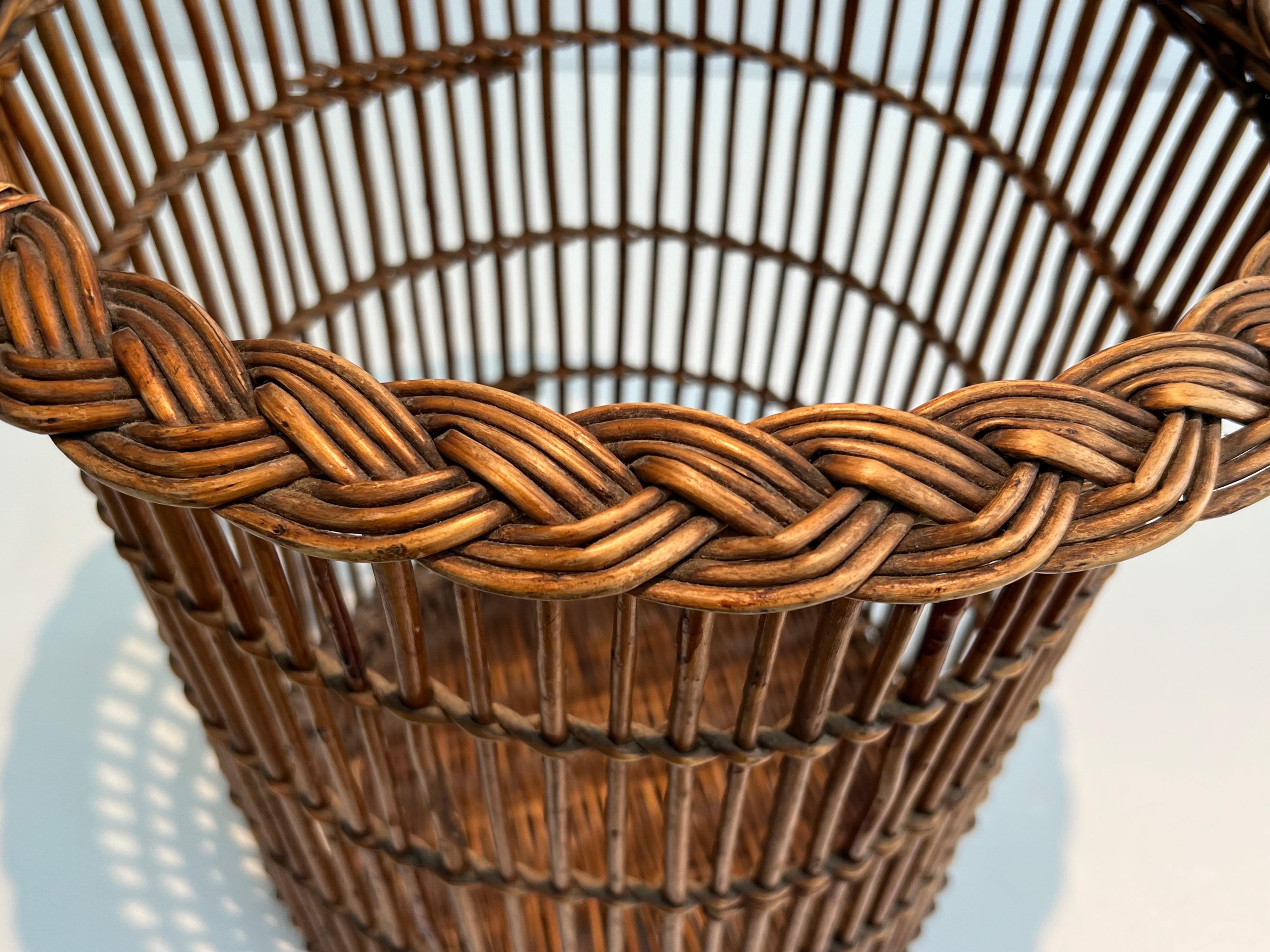 Mid-Century Modern Rattan waste paper basket. French work. Circa 1950