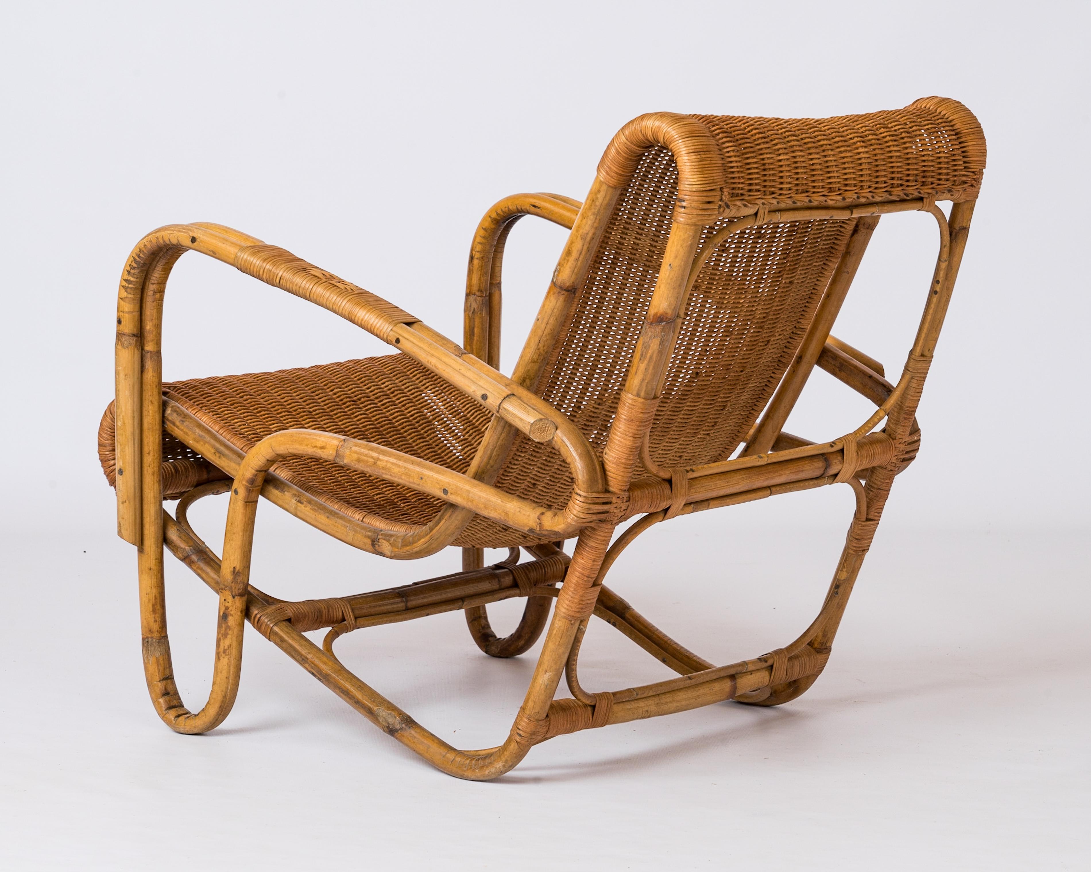 Rattan & Wicker Armchair in the style of Joseph André Motte - France 1960's In Good Condition For Sale In New York, NY