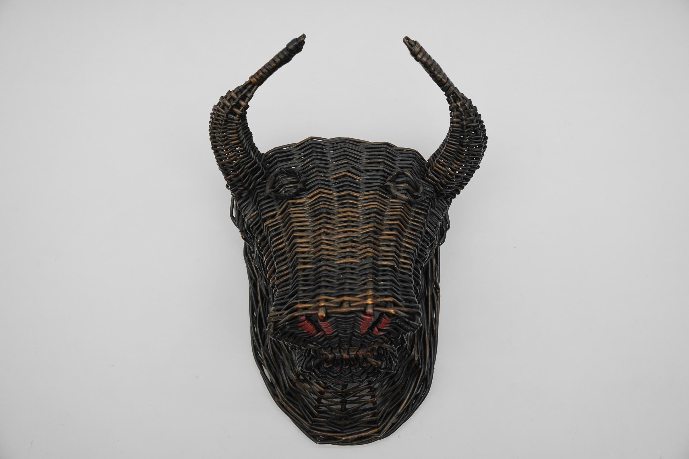 Very rare rattan bull head, wicker wall decoration dates to the 1960s-1970s

The proportions are perfect, very decorative.

We still have a bull head in rattan which is woven very similarly.