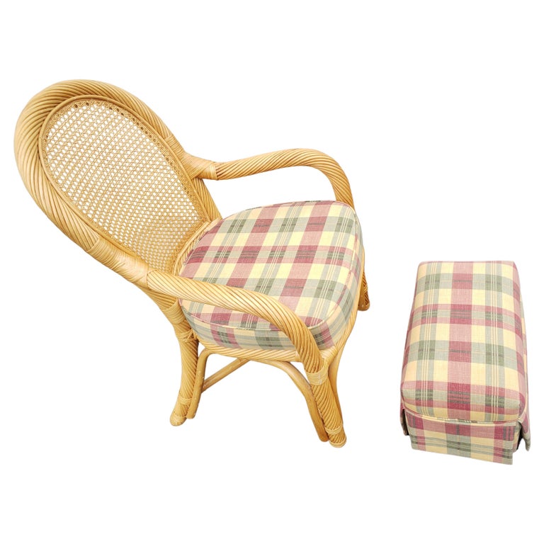 Rattan Wicker caned back upholstered chair with ottoman set. Excellent vintage condition. Very comfortable. 
Measurements : Chair: 22.5
