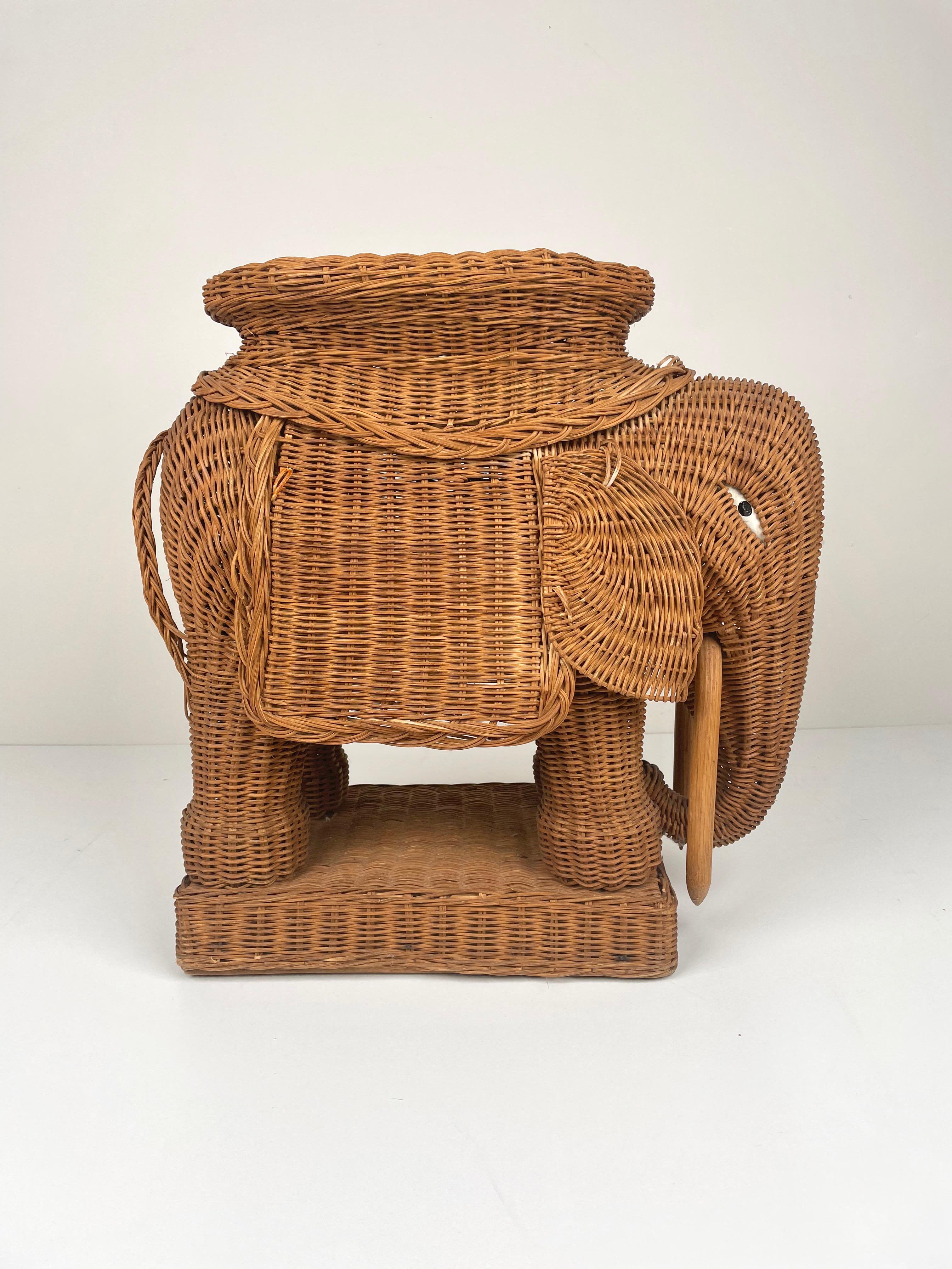 Elephant-shaped end coffee table in hand-braided rattan accented with wood tusks. Made in France, 1960s.