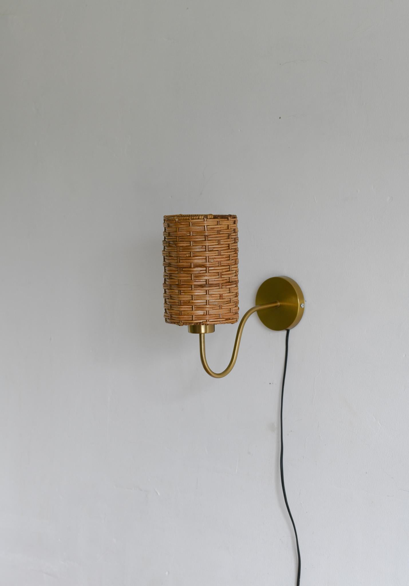 Hand-Crafted Rattan wicker wall sconce For Sale