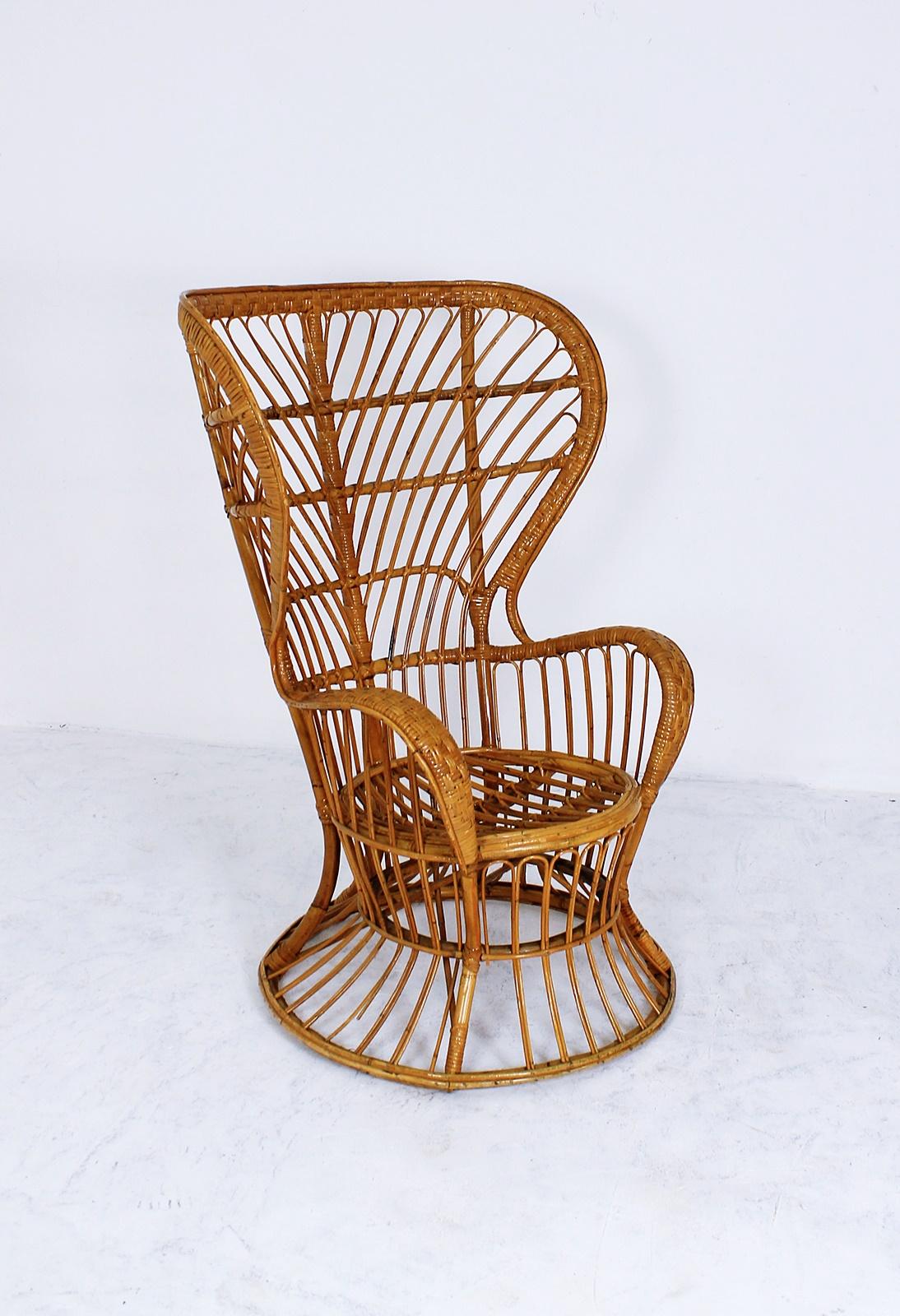 This Italian handcrafted midcentury rattan high back armchair was designed by Lio Carminati in the 1950s and manufactured by Pierantonio Bonacina. The item was specifically designed for the cruise ship Conte Biancamano.

Wear consistent with age and