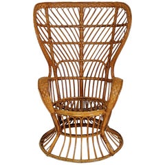 Rattan Wingback Armchair by Lio Carminati for Bonacina, Italy, 1950s