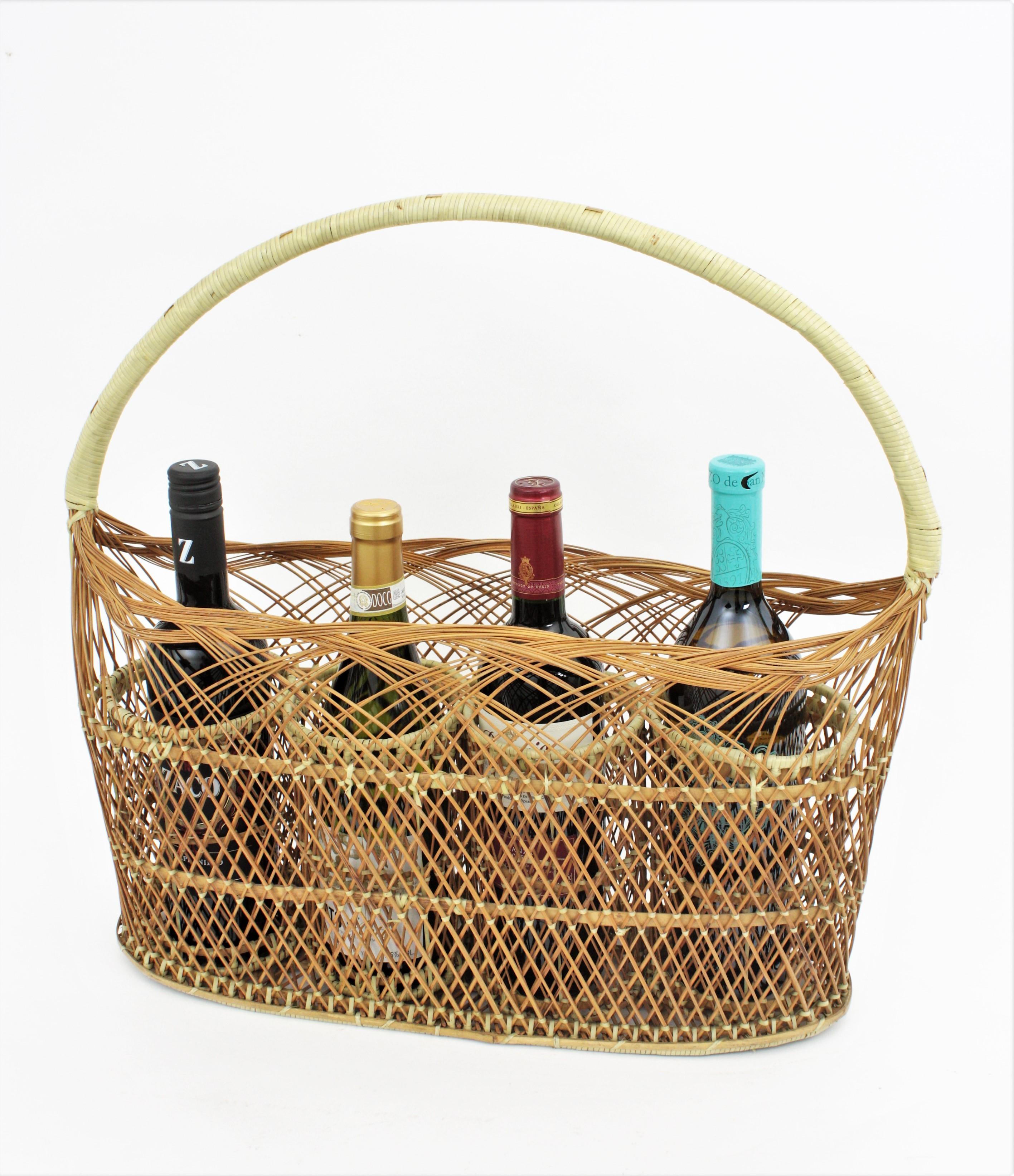 French bottle basket stand in hand-woven rattan and wicker, 1960s

Handcrafted woven wicker and rattan wine bottle rack or basket. It has a handle and 4 compartments.
This wine bottle rack is a shabby chic kitchen display stand with all the taste