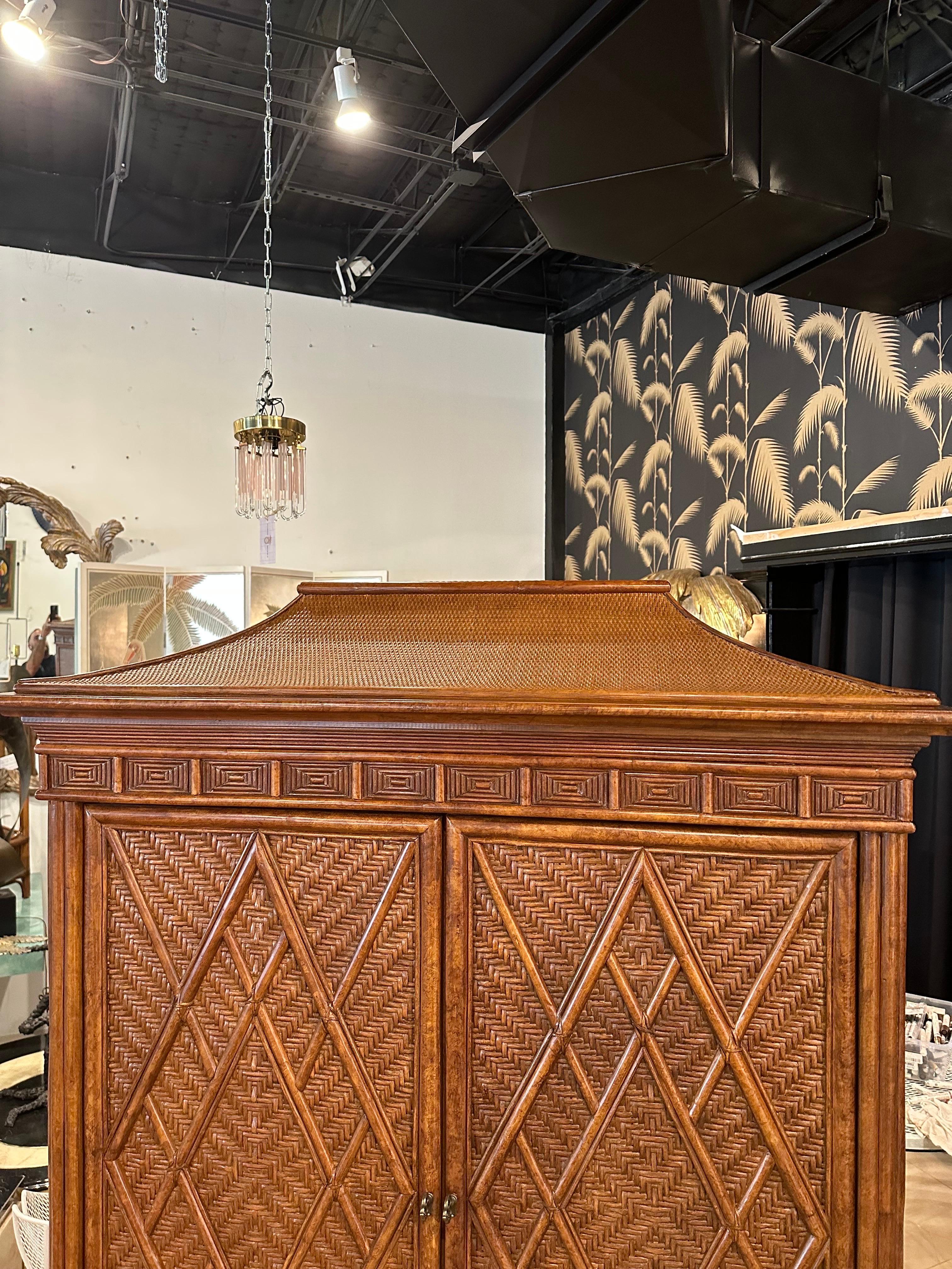 Vintage rattan, woven wicker, pagoda top bar armoire cabinet chest. Chinese Chippendale accents, two pieces, love that the doors slide out and then recess inside the cabinet! Perfect to back with a mirror and add shelves for a fabulous bar!