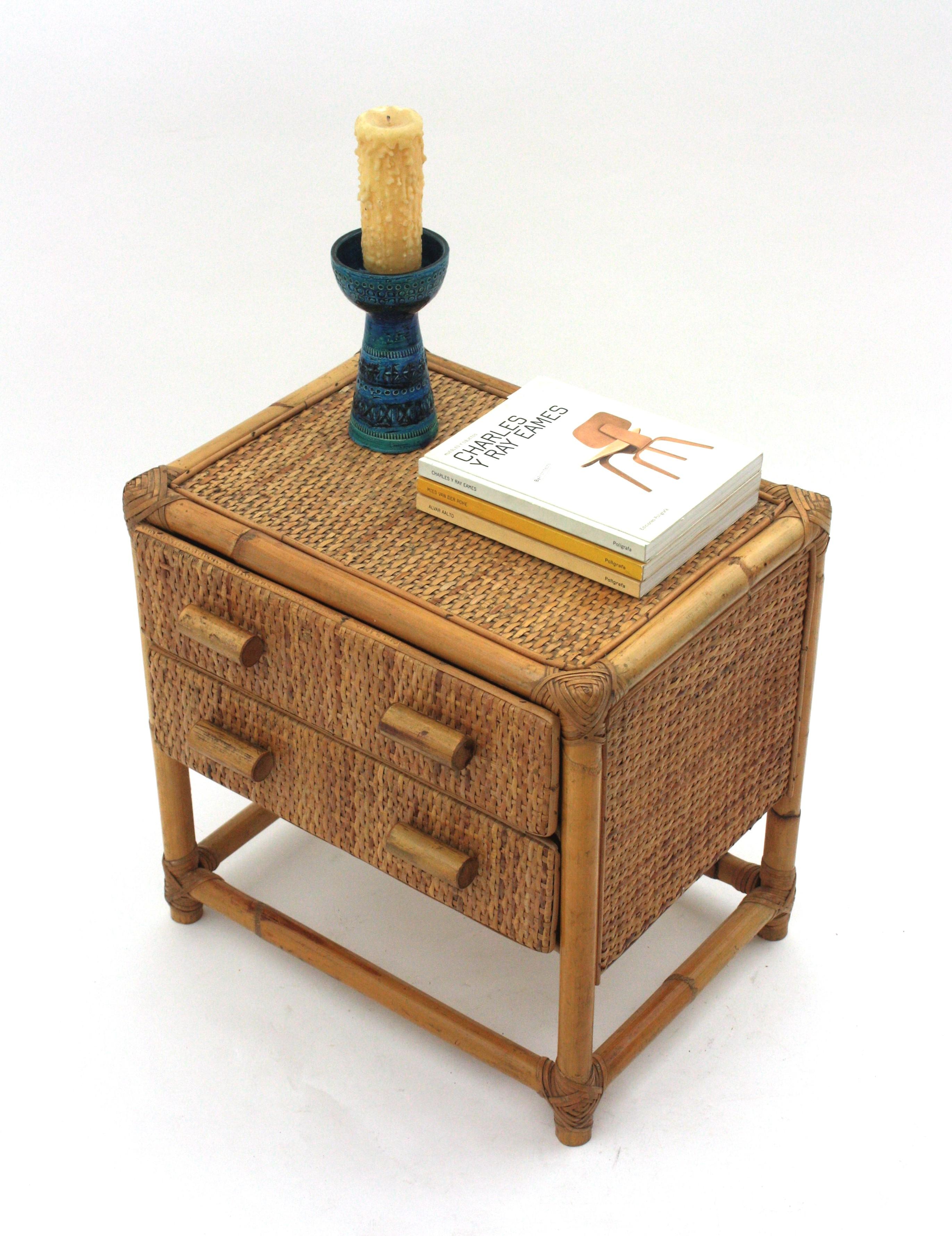 Two Drawer Rattan Bamboo Side Table or Bed Side Table, France, 1960s.
Eye-catching rattan and canage table with two drawers and bamboo pulls.
This rattan and bamboo table has a nice construction and all the taste of the French Riviera style.
It will