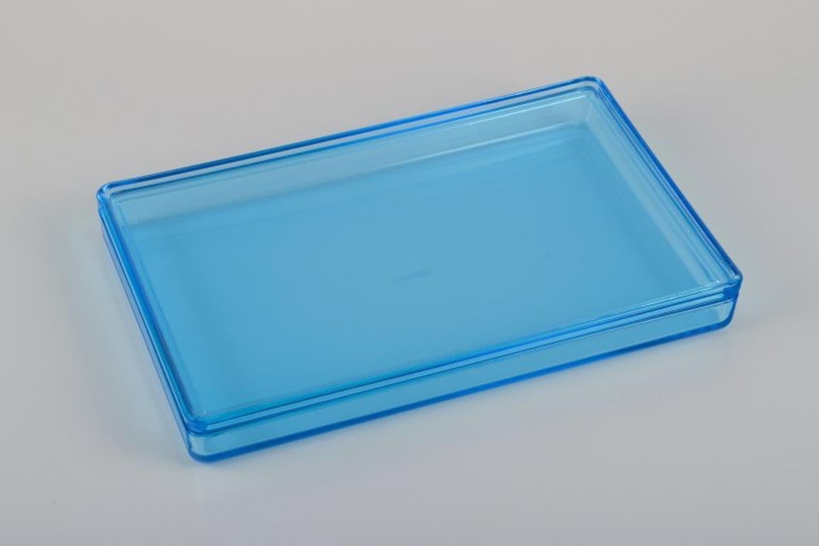 Rauff & Møldrup for Holmegaard. 
Two large Thurø storage boxes in turquoise blue art glass. 
Winner of the RED DOT Design Award 2008 for the Thurø Line.
In perfect condition.
With label.
Dimensions: 28.0 cm x 17.0 cm x 3.5 cm.







