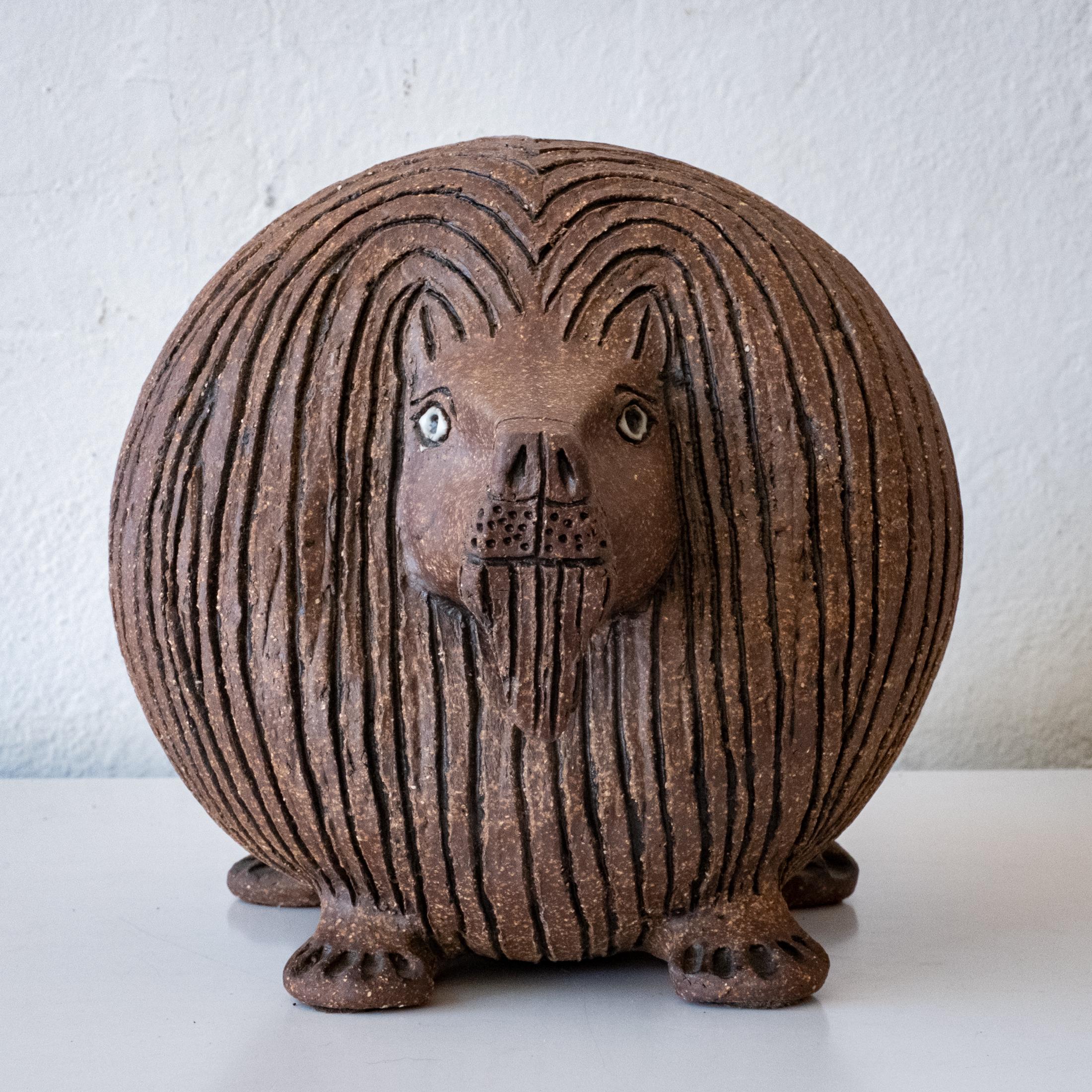 Ceramic lion sculpture by Raul Coronel. Signed CORONEL on the bottom. 

Raul Angulo Coronel (1926-) was born in the Mexico and immigrated to the United States and served in the US Marine Corps in WWII. He attended UC Berkeley and earned a degree in