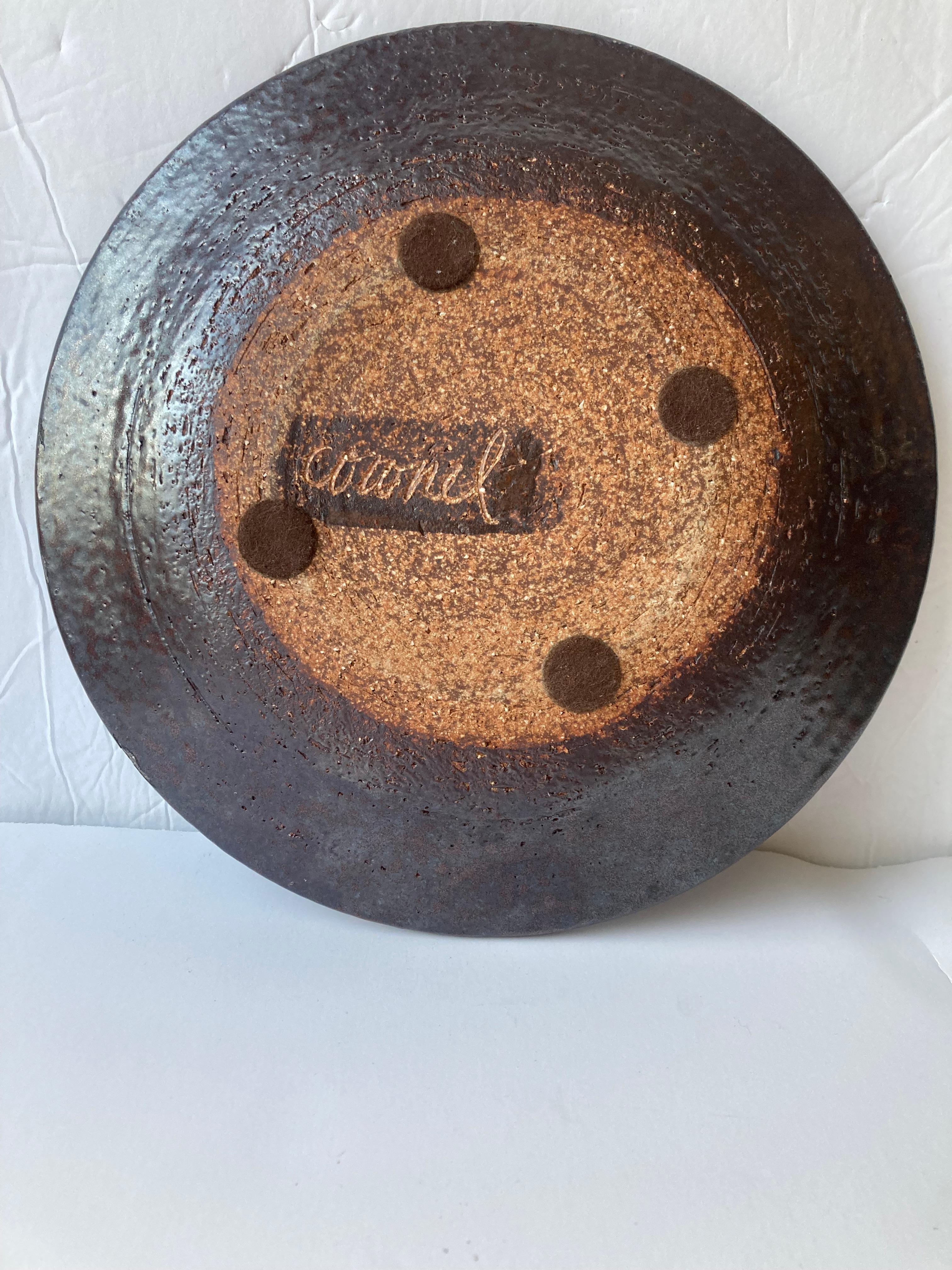 Beautiful plate by the well known potter Raul Cornell .