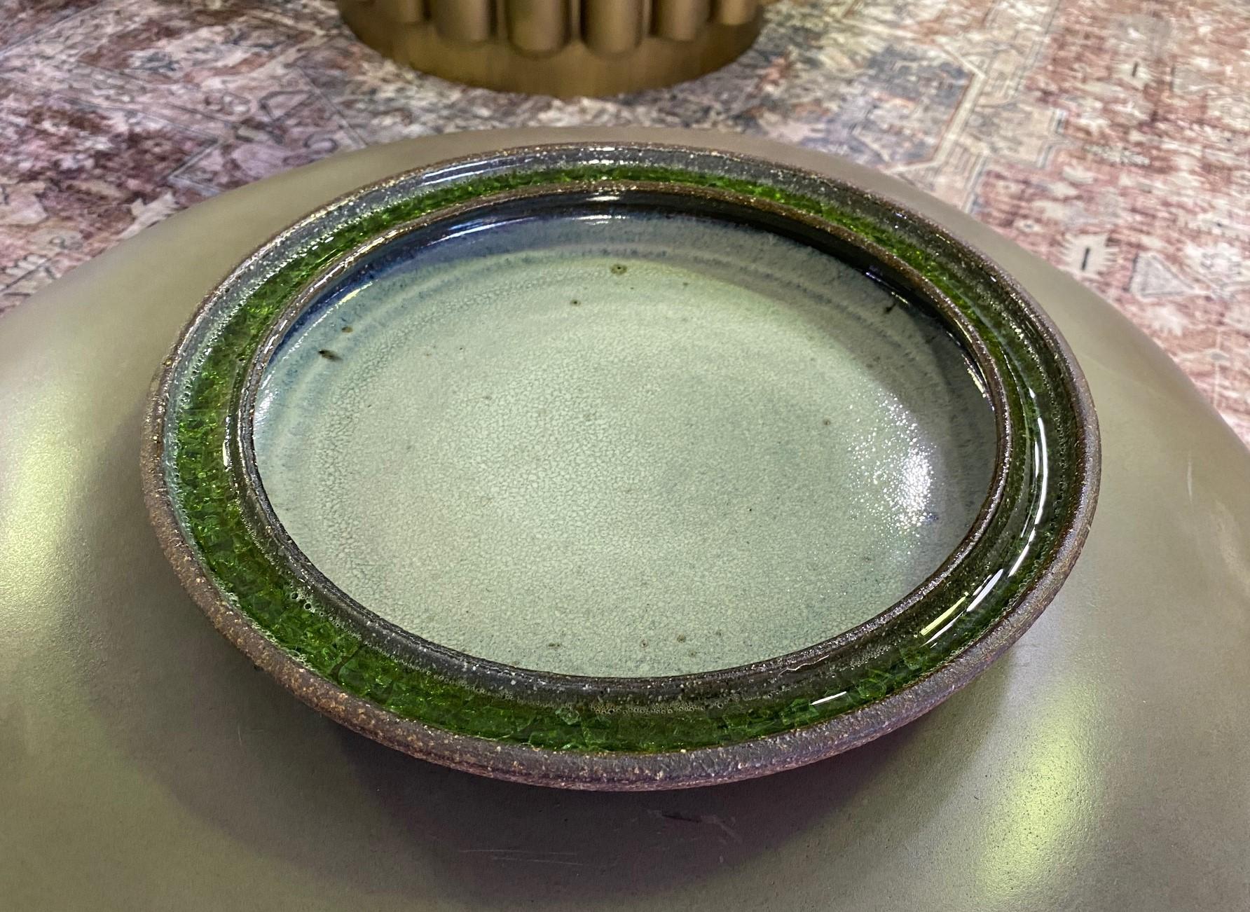 A wonderfully made and colored heavy bowl by Mexican born ceramic master Raul Coronel who played an important role in the American (he became a naturalized citizen) / California design movement of the 1950s-1970s alongside Peter Voulkos, Beatrice