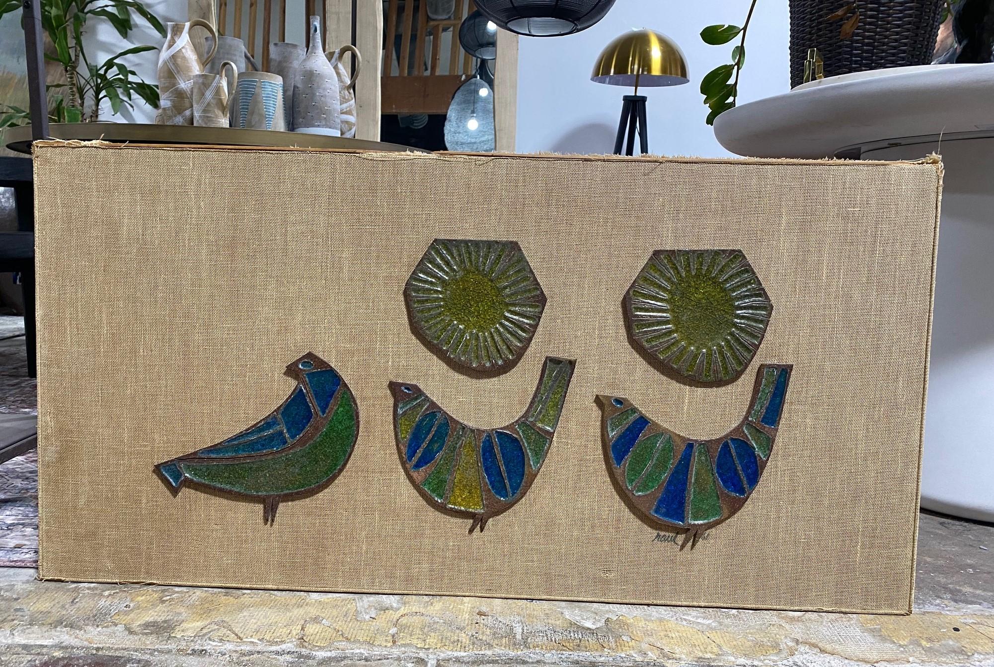A wonderful, exceptionally large, and rather rare Mid-Century Modern stoneware wall plaque/ sculpture depicting a set of birds - perhaps partridges or doves, by Mexican American ceramic master Raul Coronel who played an important role in the