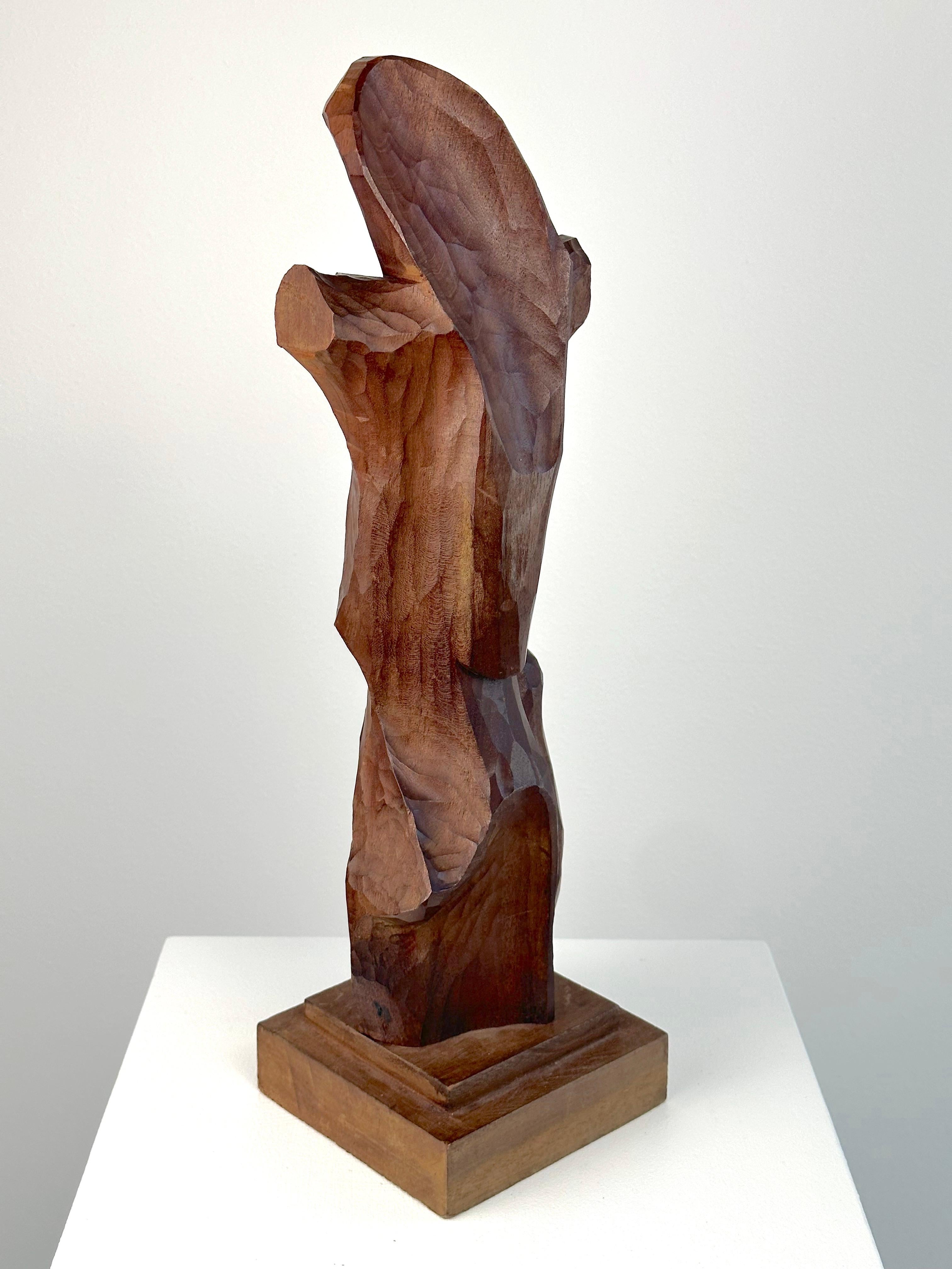 Raul Diaz (Argentina, b.1950). Abstract Figure, ca. 1970s. Canved Walnut. Measures 17 inches tall including wood base. Carved signature in lower region. Excellent condition. 

An early example of the artist's abstract figurative work. 

Raul Diaz's