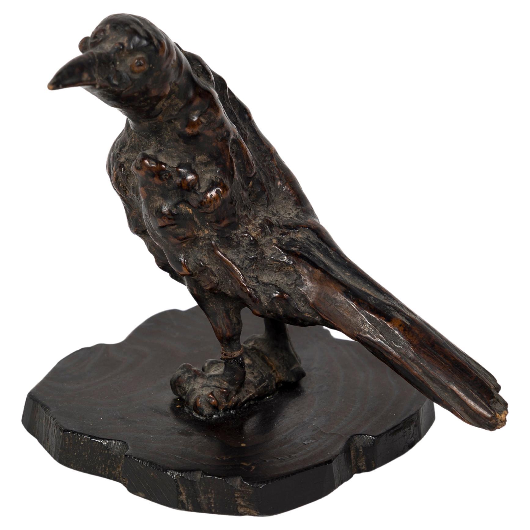 Sculpture okimono en buis de Corbeau