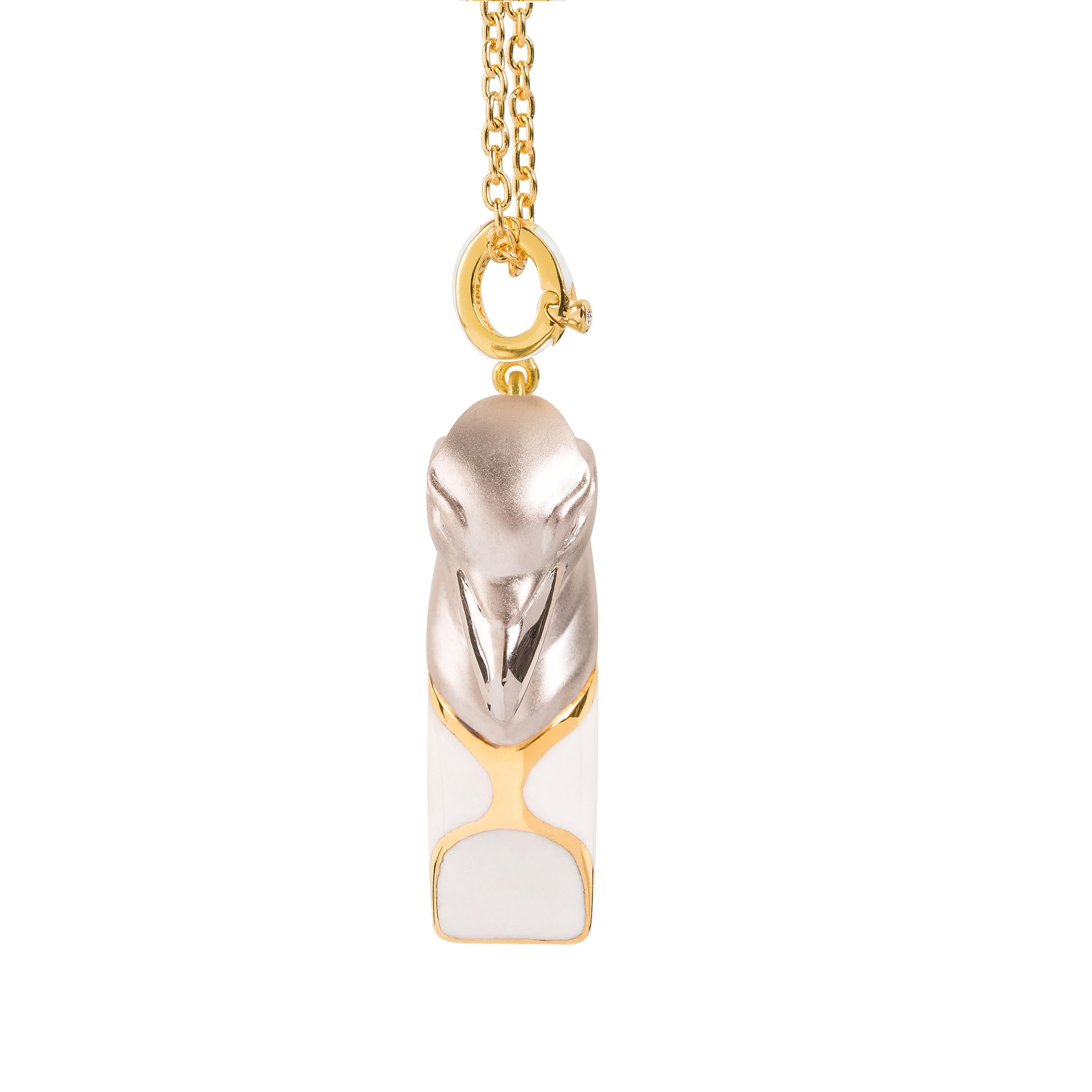 Raven whistle pendant necklace in Sterling silver, 18K gold micron and White Rhodium plated, featuring Muninn the Raven of Odin. White enamel.
Handcrafted in the Istanbul atelier, by master artisans.
Fully functional emergency whistle. It puts out a