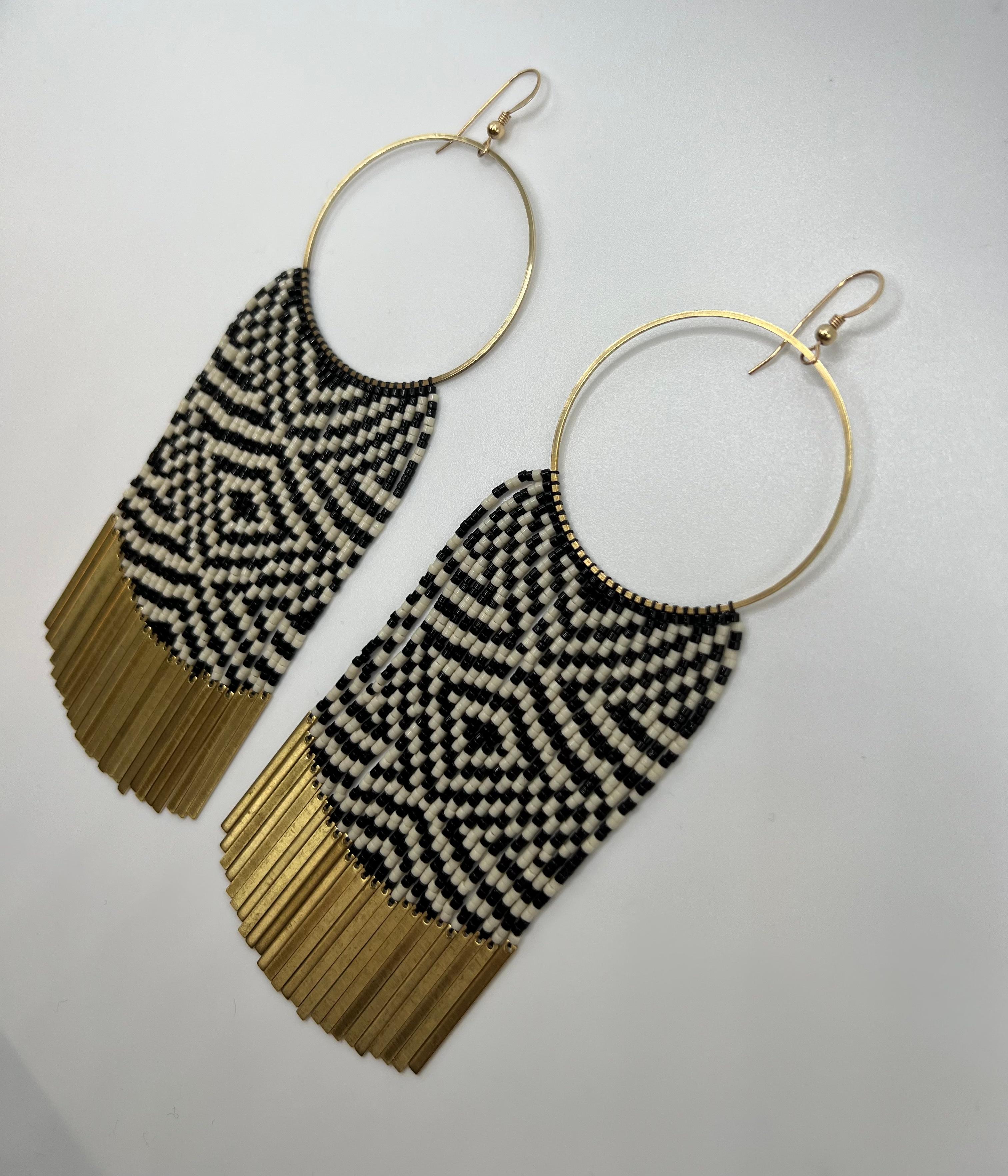 These earrings feature the Raven’s Tail pattern ‘Diamonds’ Raven’s Tail is an ancient form of textile weaving practiced by the Indigenous Peoples of the Northwest coast of North America. Once an extinct art Raven’s Tail has seen a major resurgence