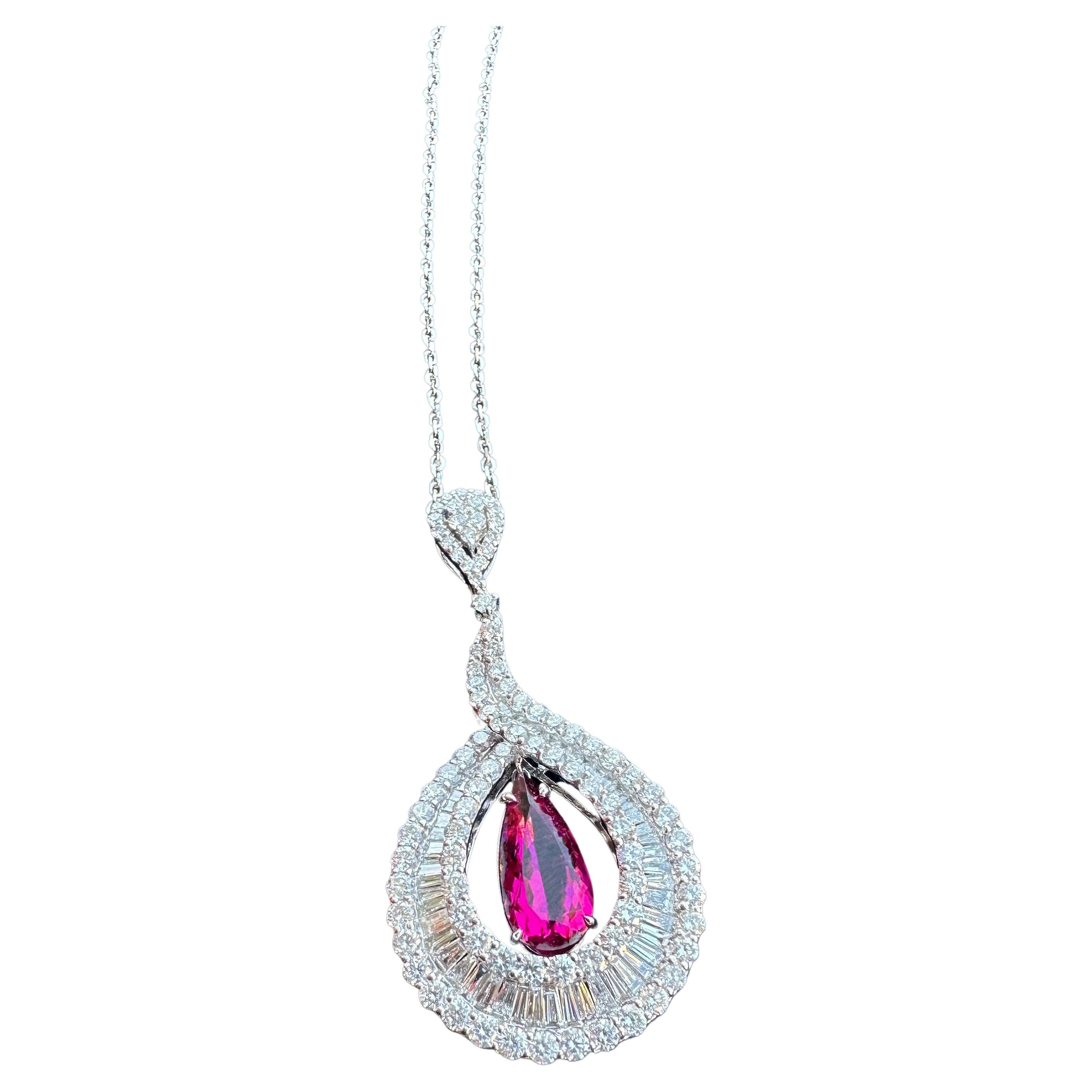 Ravishing, very dazzling in real life, 18 karat white gold vivid pinkish red natural no heat Brazilian rubellite and diamond tear drop or pear shaped pendant on chain has a combined total carat weight of approximately 10.20 carats. 

The pendant