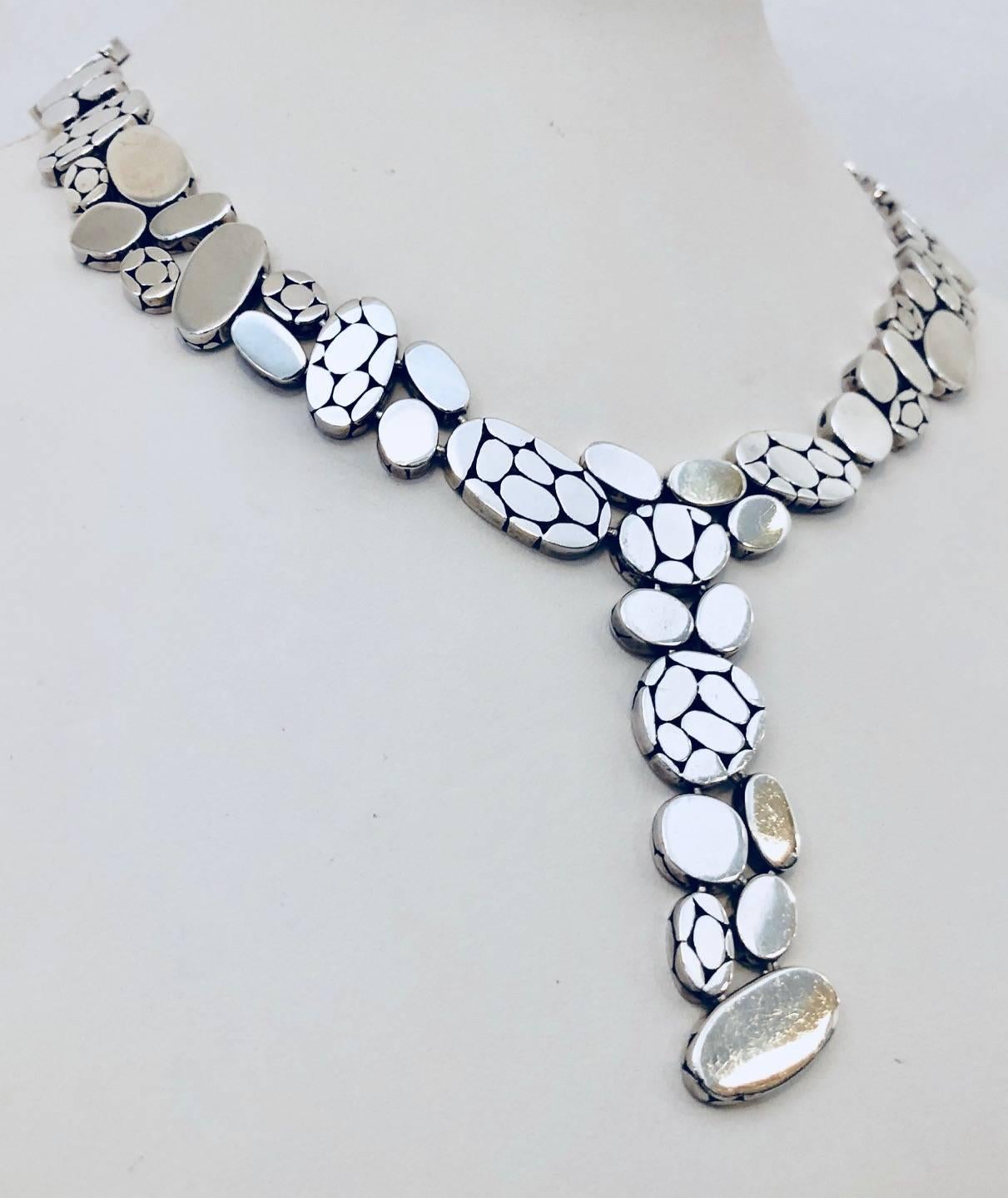 Discover the world of John Hardy!  Since 1975, he has created one of a kind, artisan hand crafted pieces of stunning jewelry.  A meticulous 8 step process for creation results in works of wearable art.  From his Bali collection is this sterling