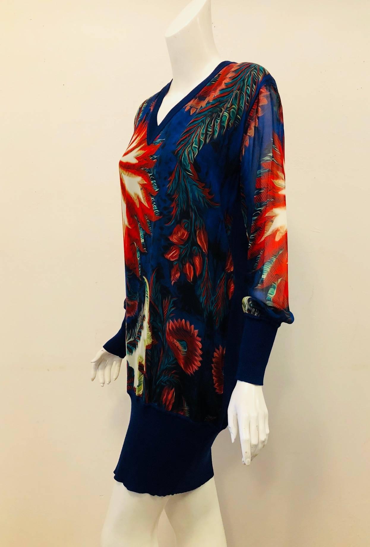Roberto Cavalli's floral print with bright royal blue wool knit and enlarged photographic floral print at front and sleeves, in a rich multicolored palette, this silk dress has us dreaming of flourishing gardens and outdoor parties.   The bright