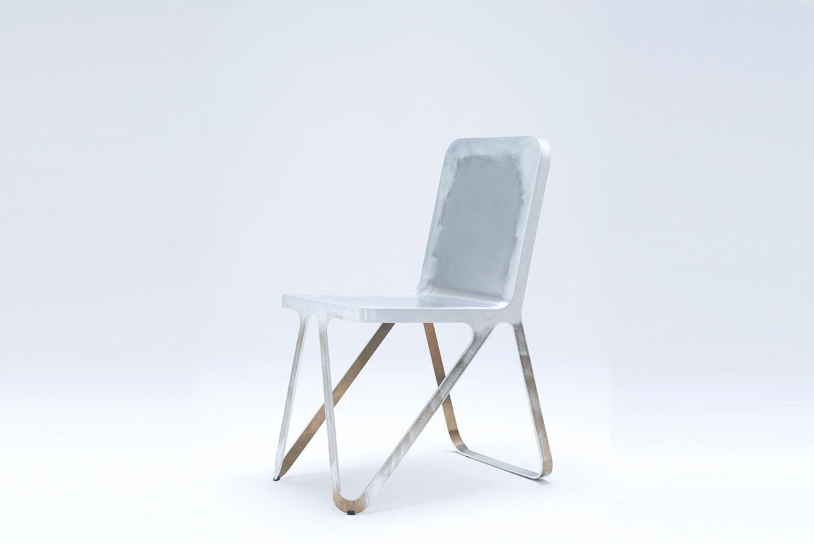 Raw Aluminium loop chair by Sebastian Scherer
Dimensions: D57x w40 x H80 cm
Material: Aluminium.
Weight: 51 kg.
Also available: Colours: Snow white / light sand / sun yellow / clay orange / rust red / space blue / graphite grey / dark bronze /