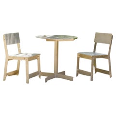 Sun Dial Bistro Set in Raw Aluminum by ORCA