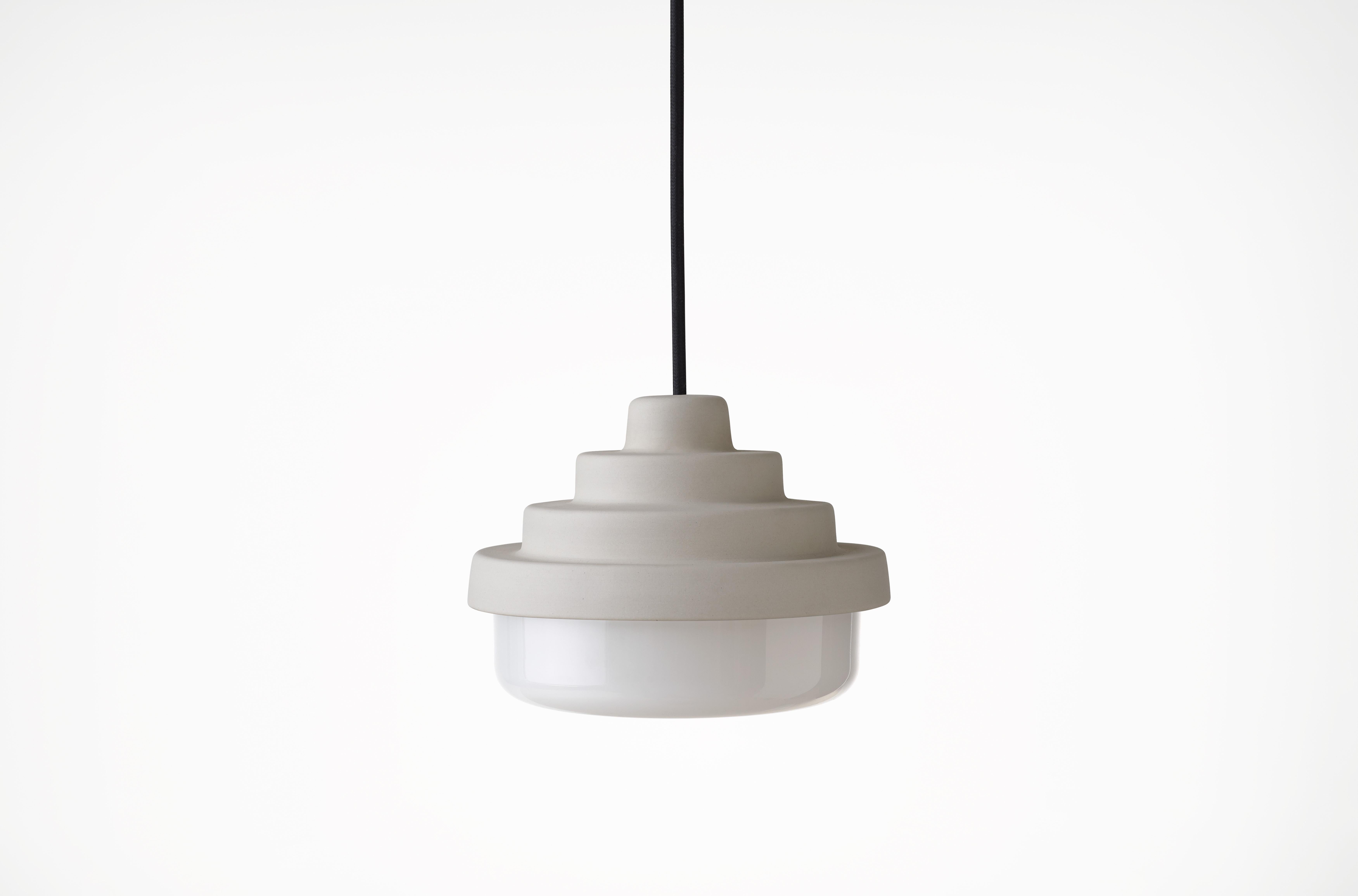 Raw and White Honey Pendant Light by Coco Flip
Dimensions: D 18 x W 18 x H 13 cm
Materials: Slip cast ceramic stoneware with blown glass. 
Weight: Approx. 2kg
Glass finishes: White.
Ceramic finishes: Raw unglazed stoneware. 

Standard fixtures