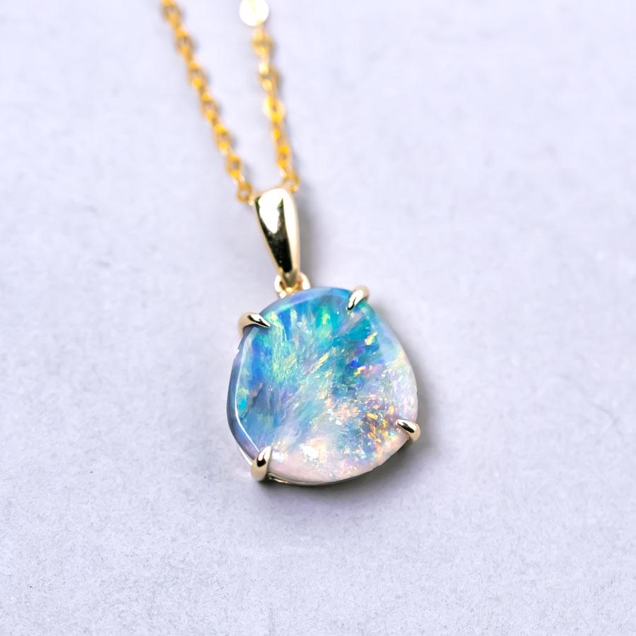 Raw Australian Black Opal Pendant Necklace 14K Yellow Gold.

Free Domestic USPS First Class Shipping! Free Gift Bag or Box with every order!

Opal—the queen of gemstones, is one of the most beautiful gemstones in the world.  Every piece of opal is