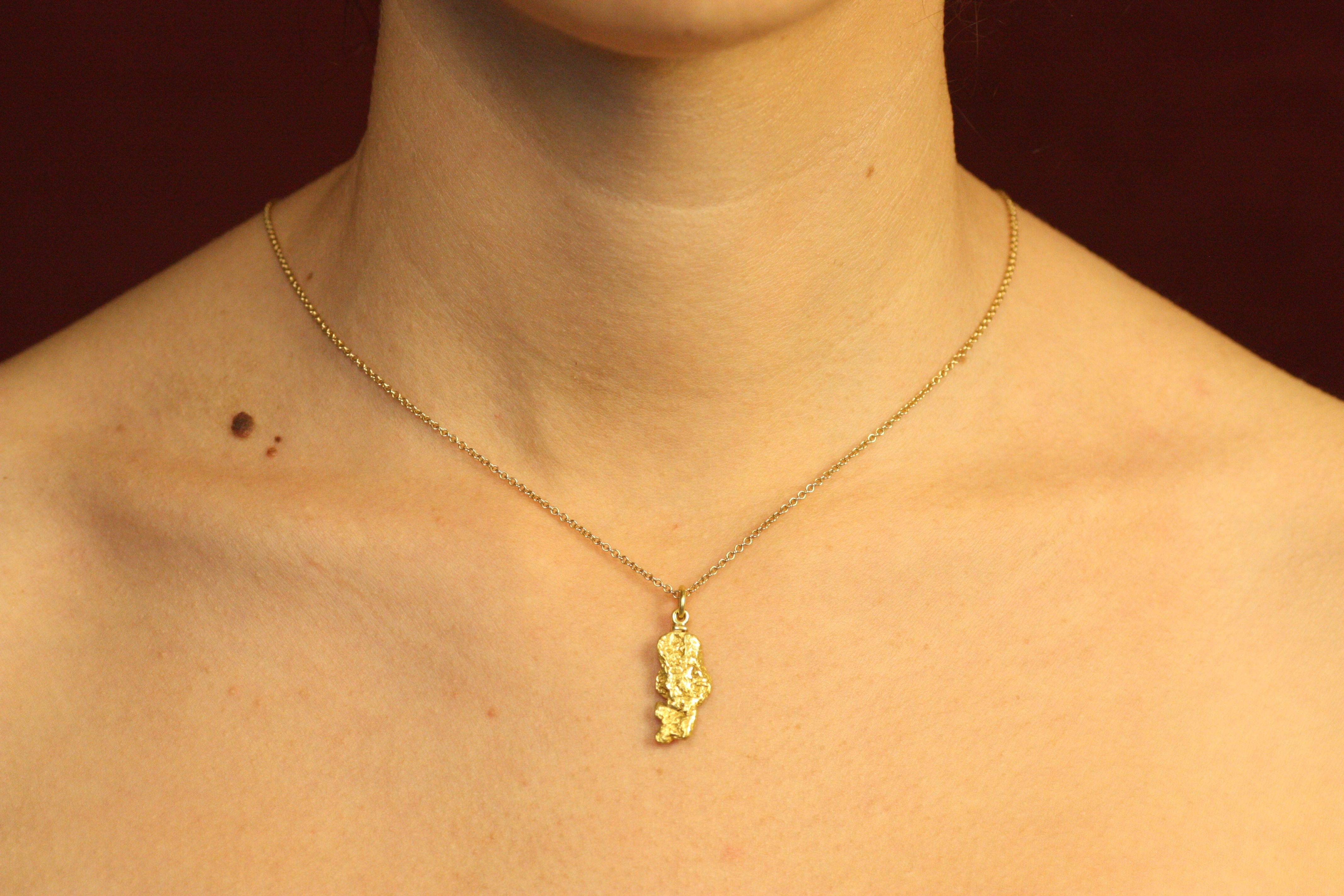A natural California Gold river nugget, which we lovingly call the “Eureka” nugget–a terrific find when mining for gold. The link that allows the nugget to hang on a chain is stamped with our California grizzly bear stamp, authenticating its genuine