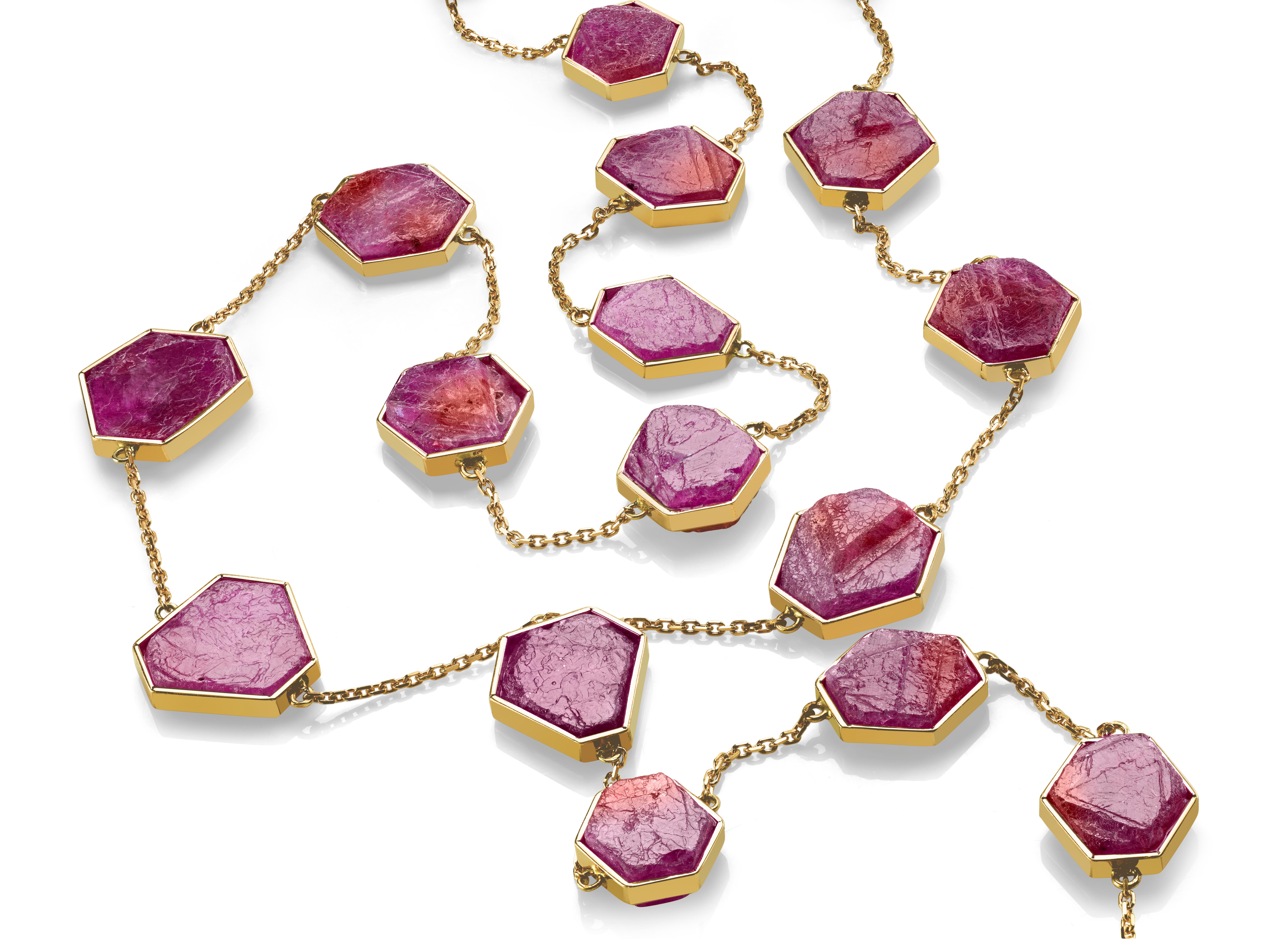 An ode to natural raw gemstones. Untouched and uncut rubies in their glorious organic perfection featured in this One-of-A-Kind Ruby Lariat.
Raw Red Ruby necklace features 23 custom geometric hexagon cut natural ruby chunks framed by 18k Rose Gold